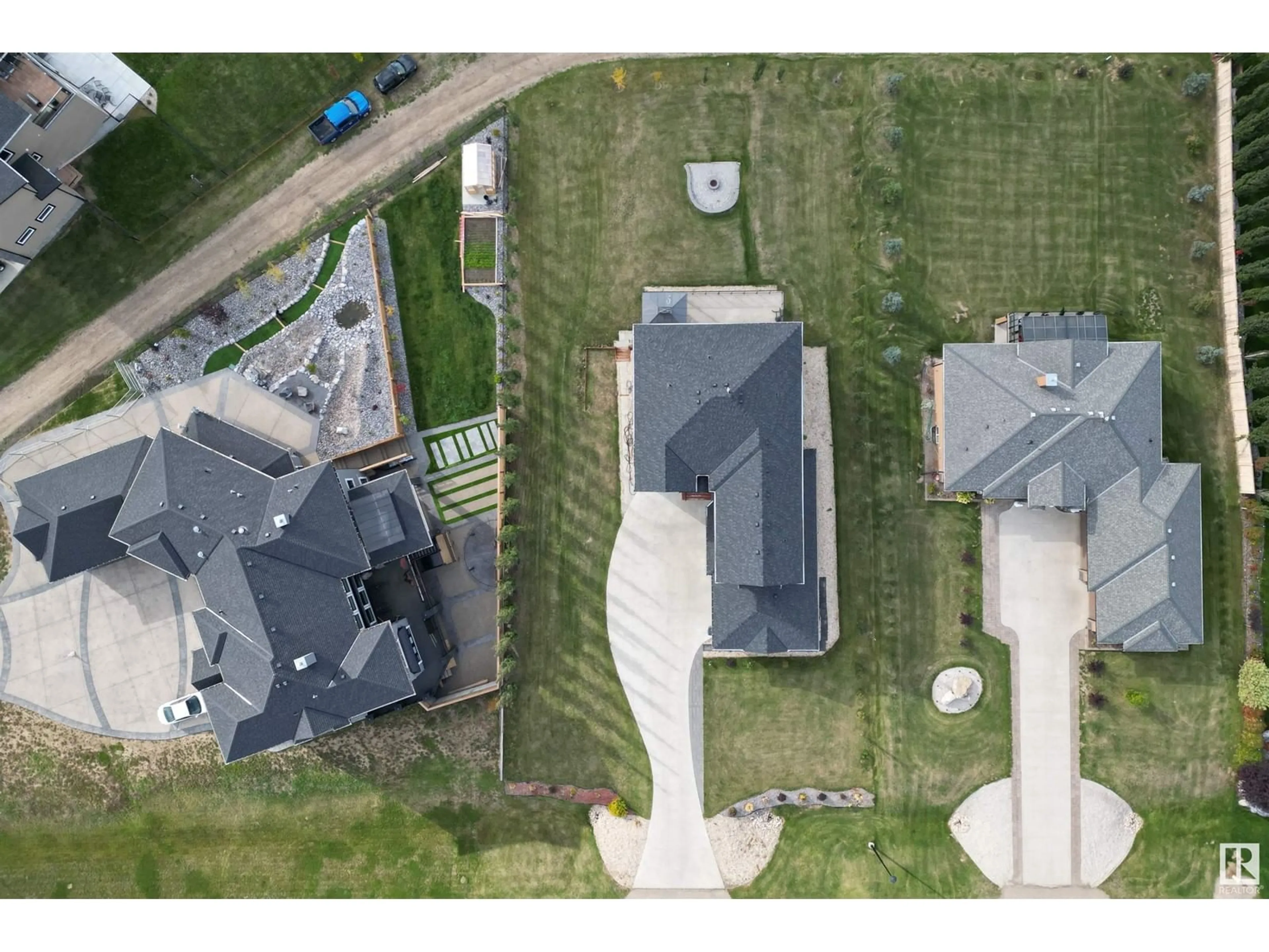 Frontside or backside of a home, the fenced backyard for #110 26116A HGHWAY 16, Rural Parkland County Alberta T7Y1A1