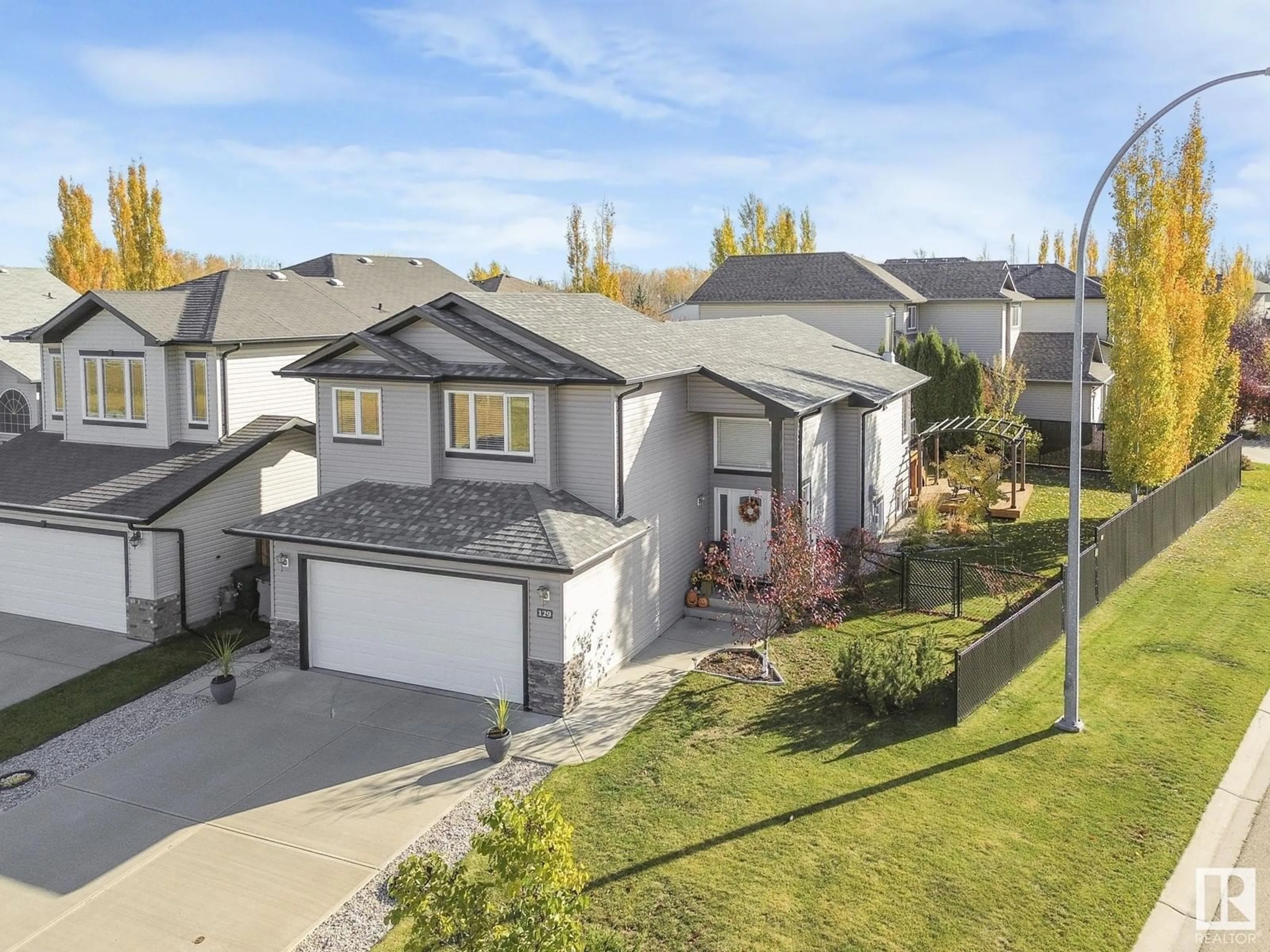 Frontside or backside of a home, the fenced backyard for 129 EAGLE RIDGE, Stony Plain Alberta T7Z0A7