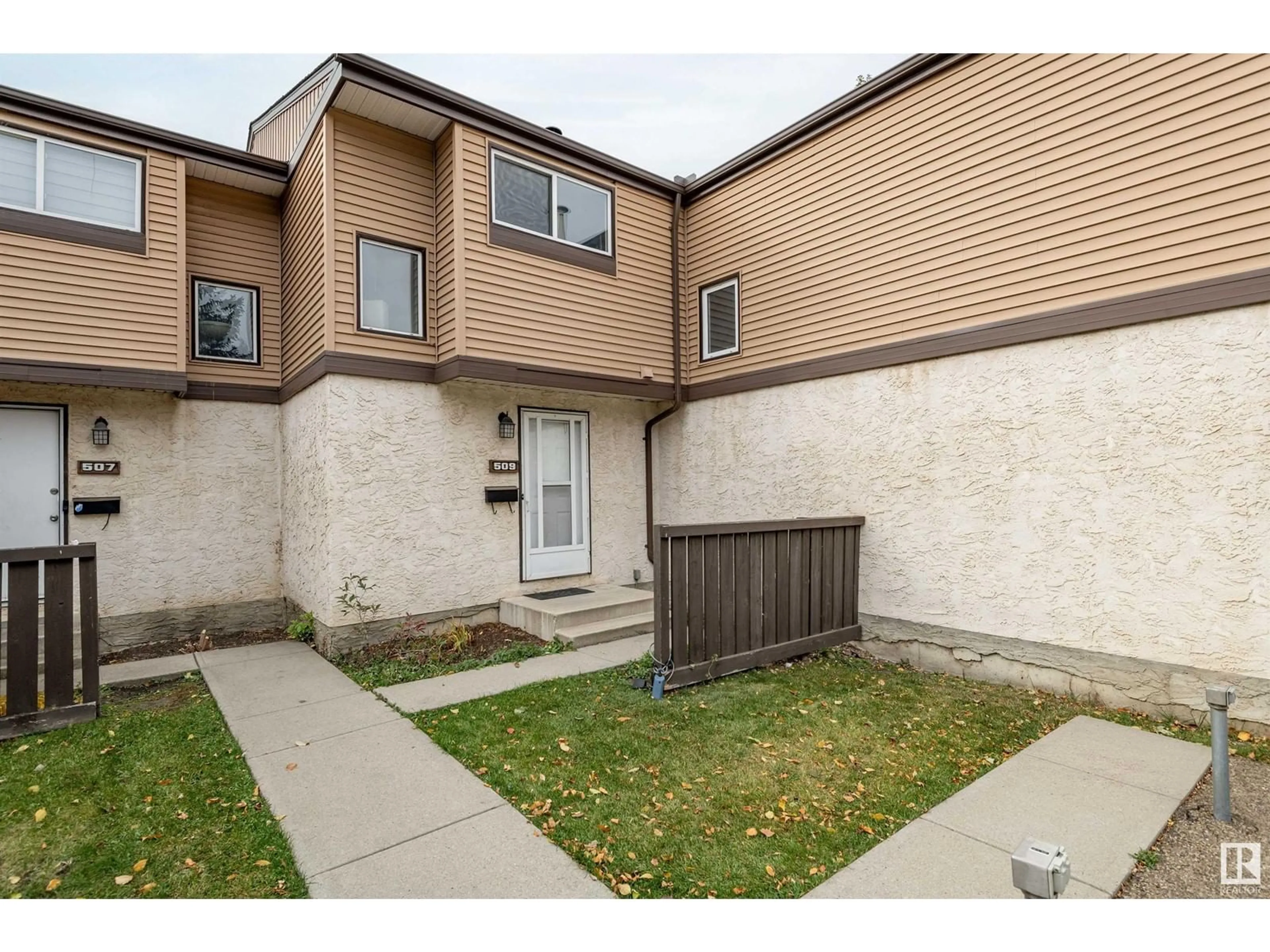 A pic from exterior of the house or condo, the fenced backyard for 509 KNOTTWOOD W NW, Edmonton Alberta T6K2V6