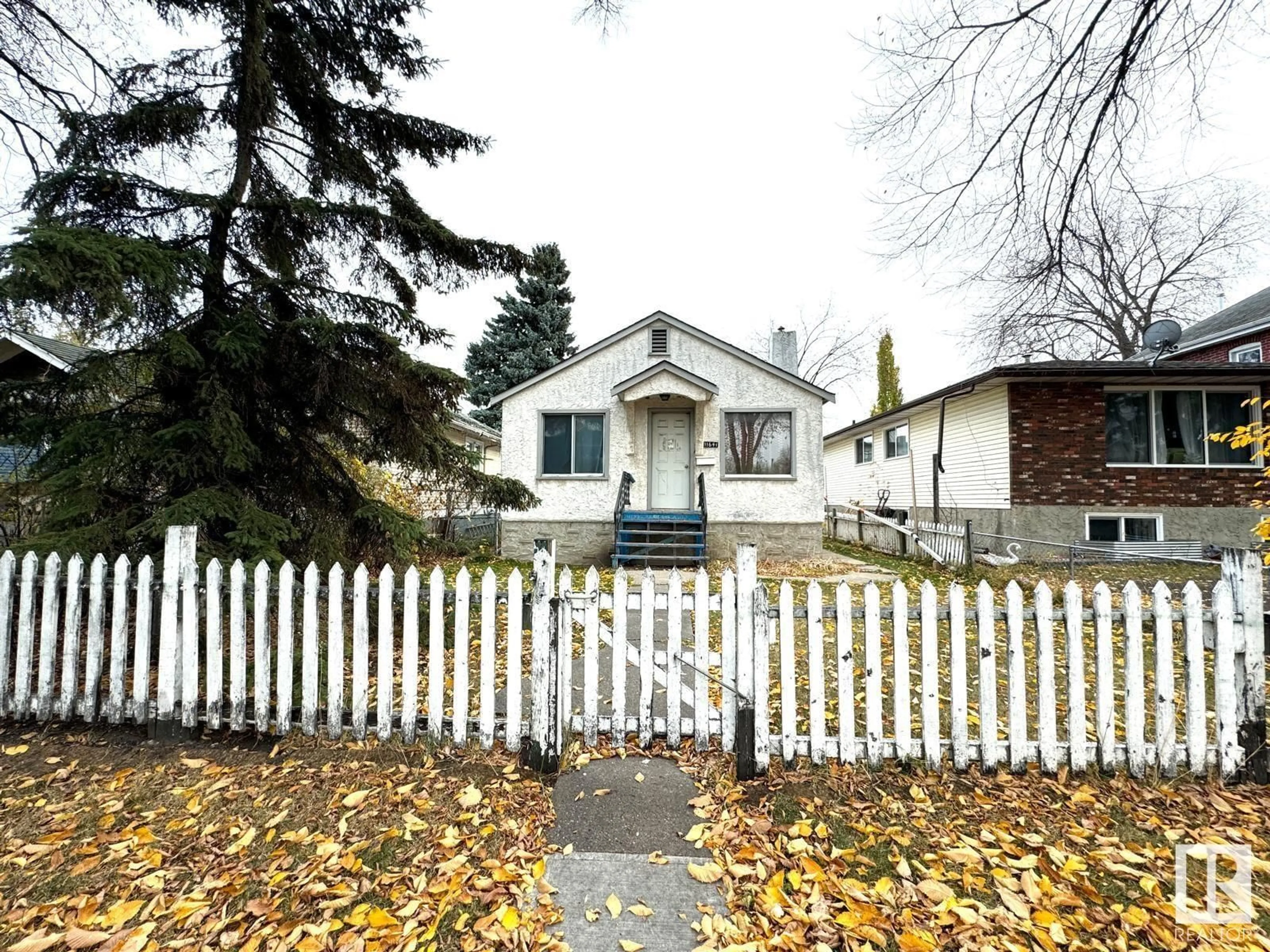 Frontside or backside of a home, the fenced backyard for 11641 95A ST NW, Edmonton Alberta T5G1P7