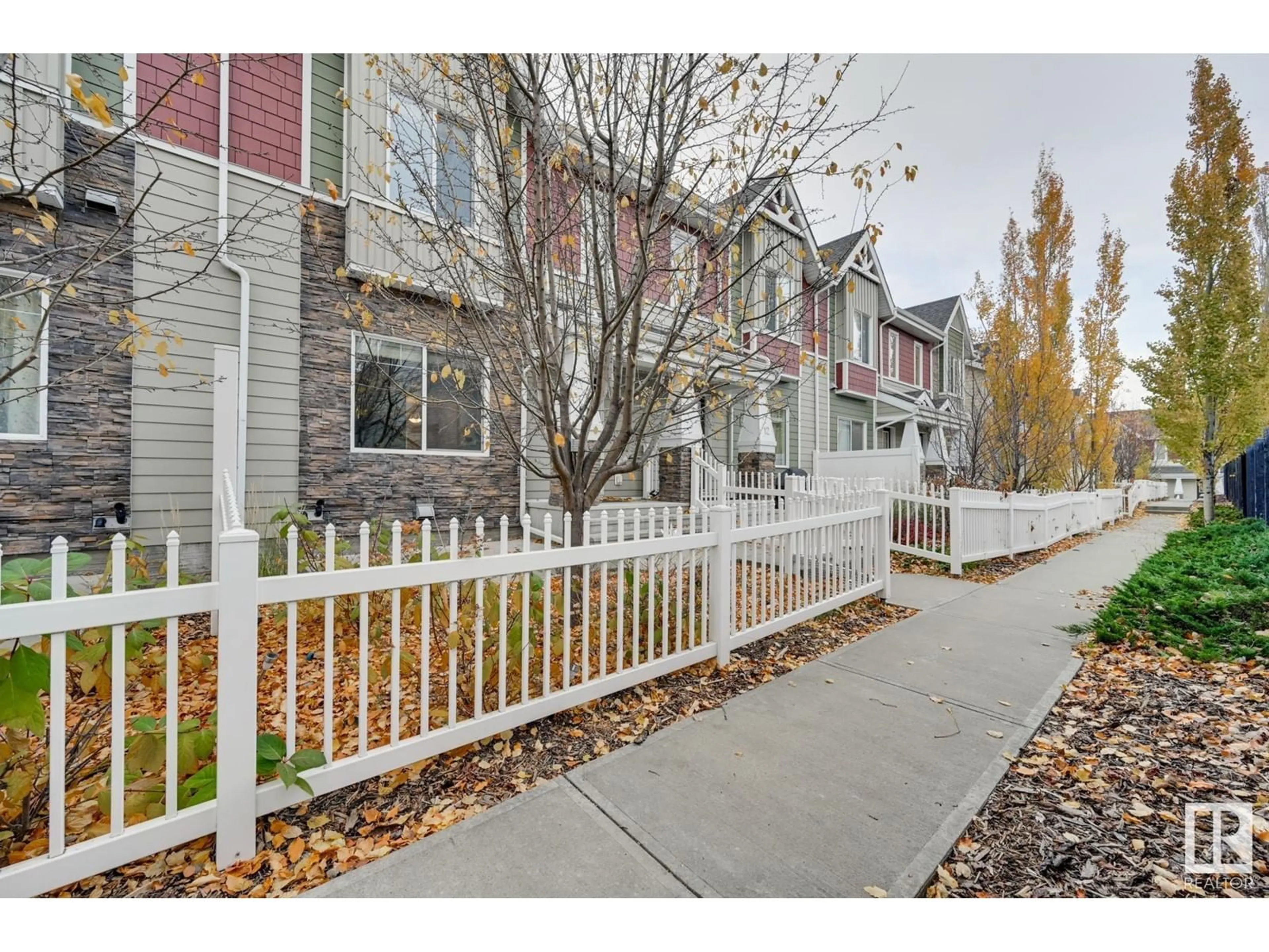 A pic from exterior of the house or condo, the fenced backyard for #11 2003 RABBIT HILL RD NW, Edmonton Alberta T6R0R7