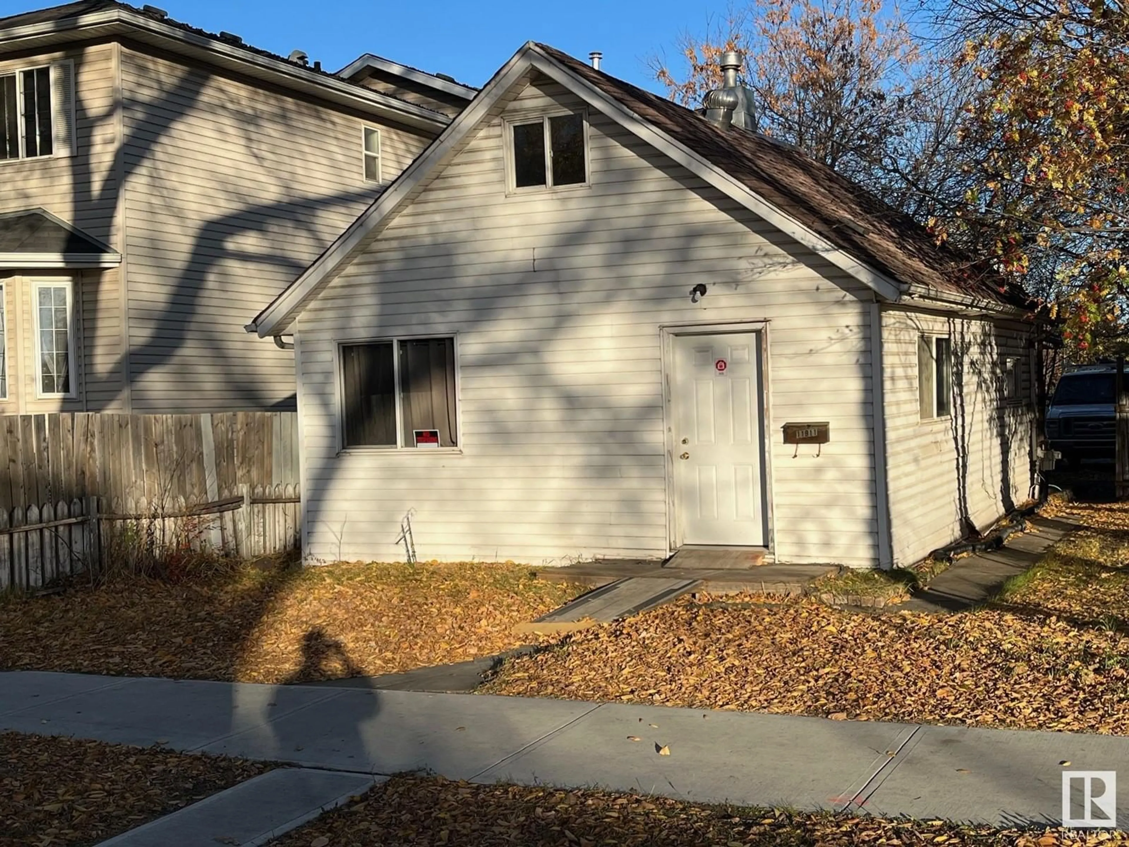 A pic from exterior of the house or condo, the front or back of building for 11911 77 ST NW, Edmonton Alberta T5B2G5