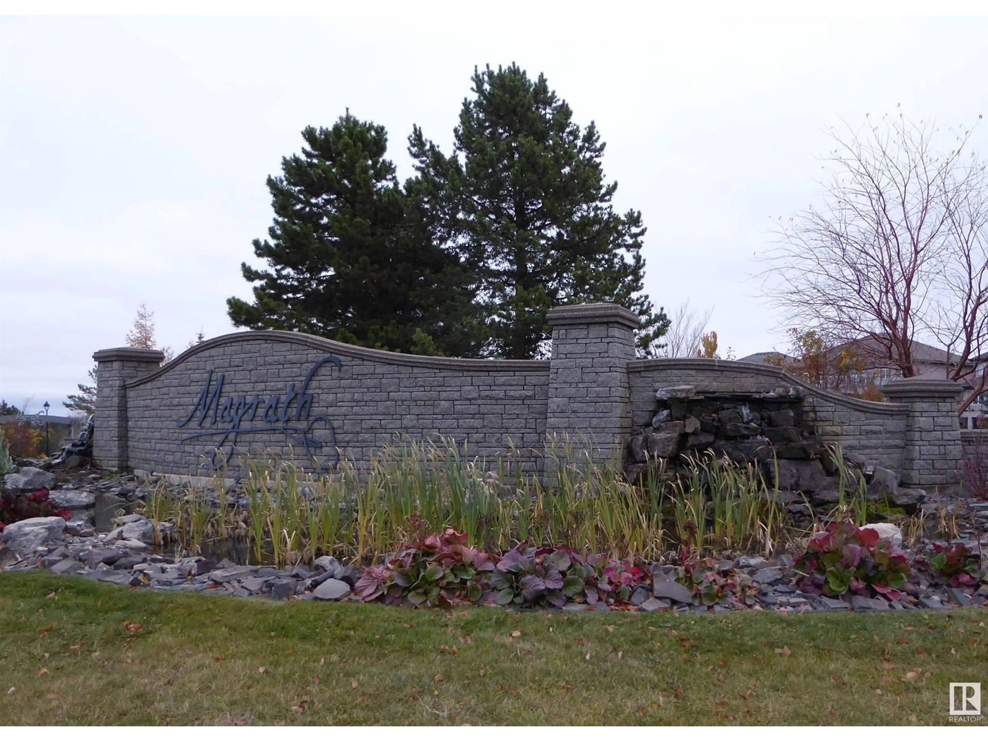 A pic from exterior of the house or condo, the fenced backyard for #201 160 Magrath RD NW NW, Edmonton Alberta T6R3T7