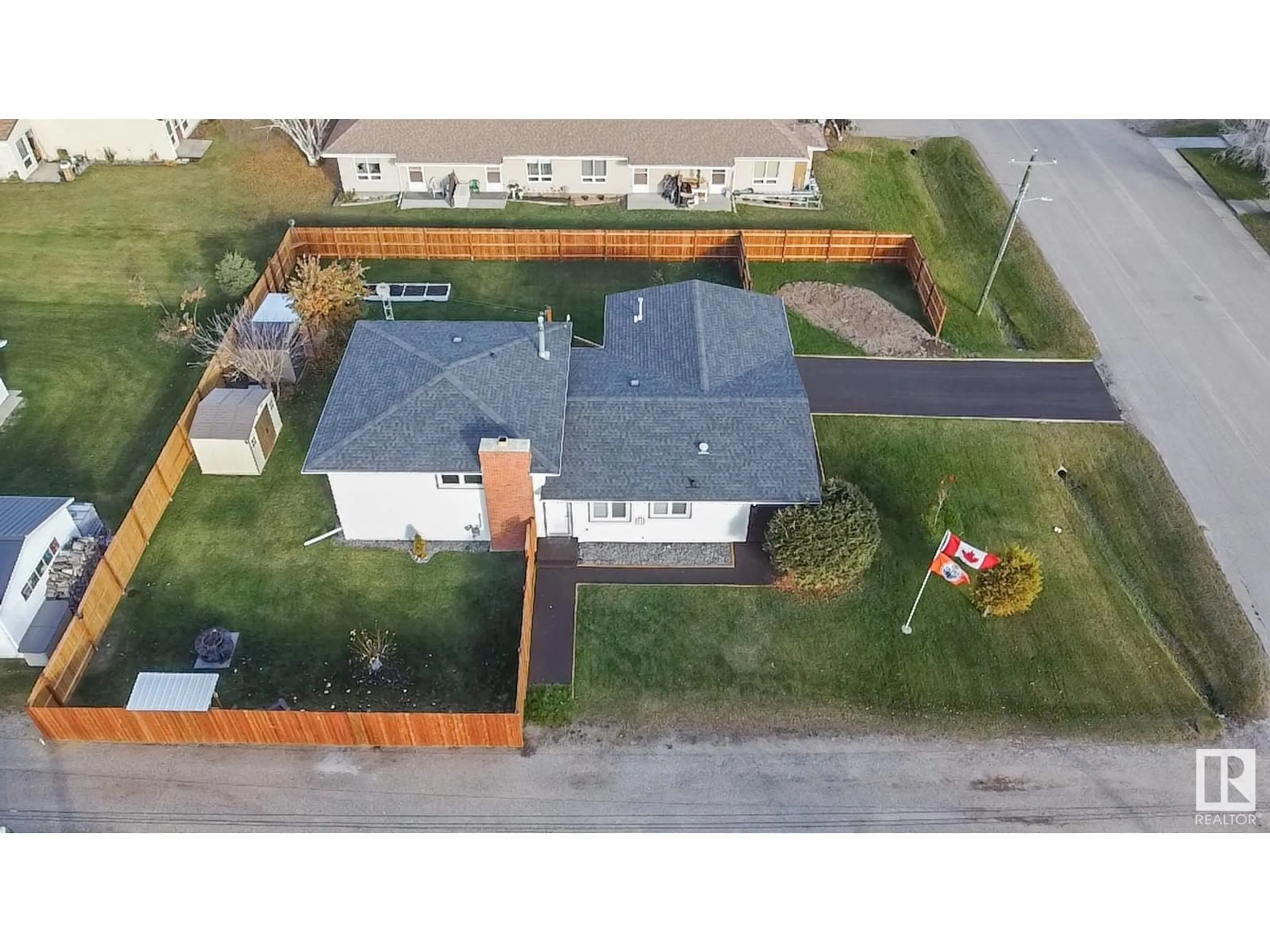 Frontside or backside of a home, the fenced backyard for 5012 51 ST, Glendon Alberta T0A1P0