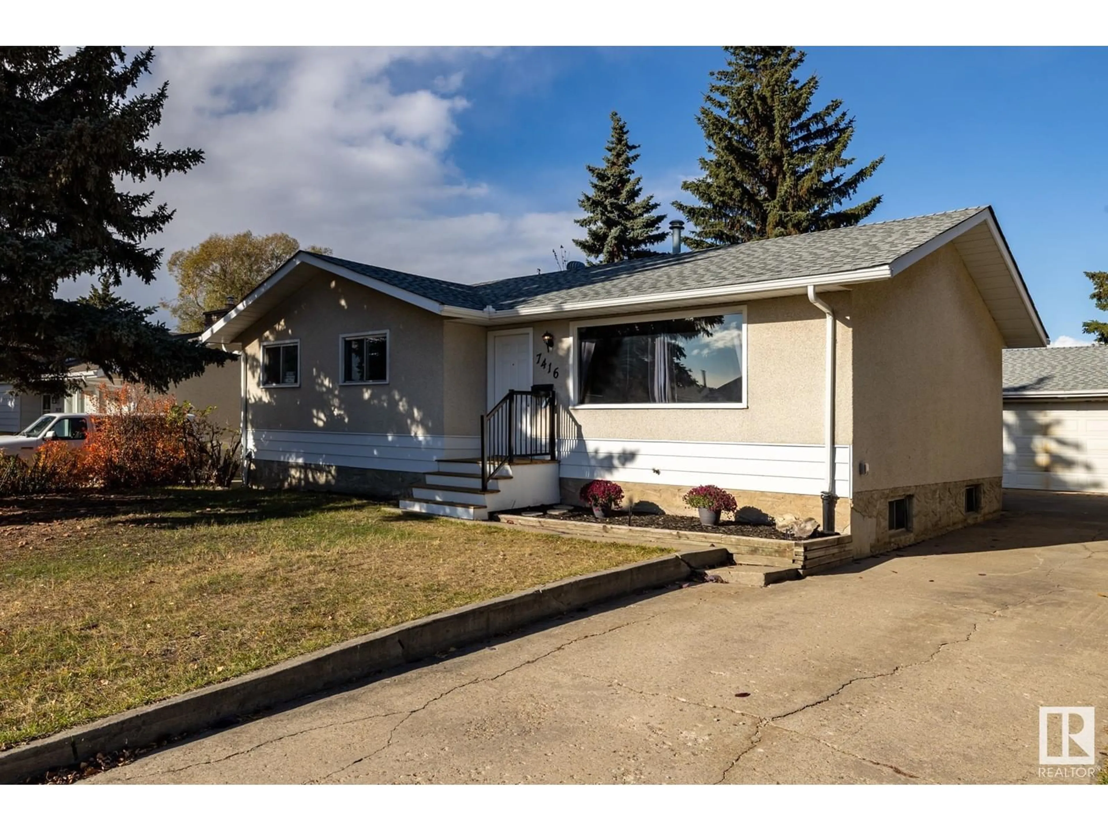 Frontside or backside of a home for 7416 32 AV NW, Edmonton Alberta T6K1J8