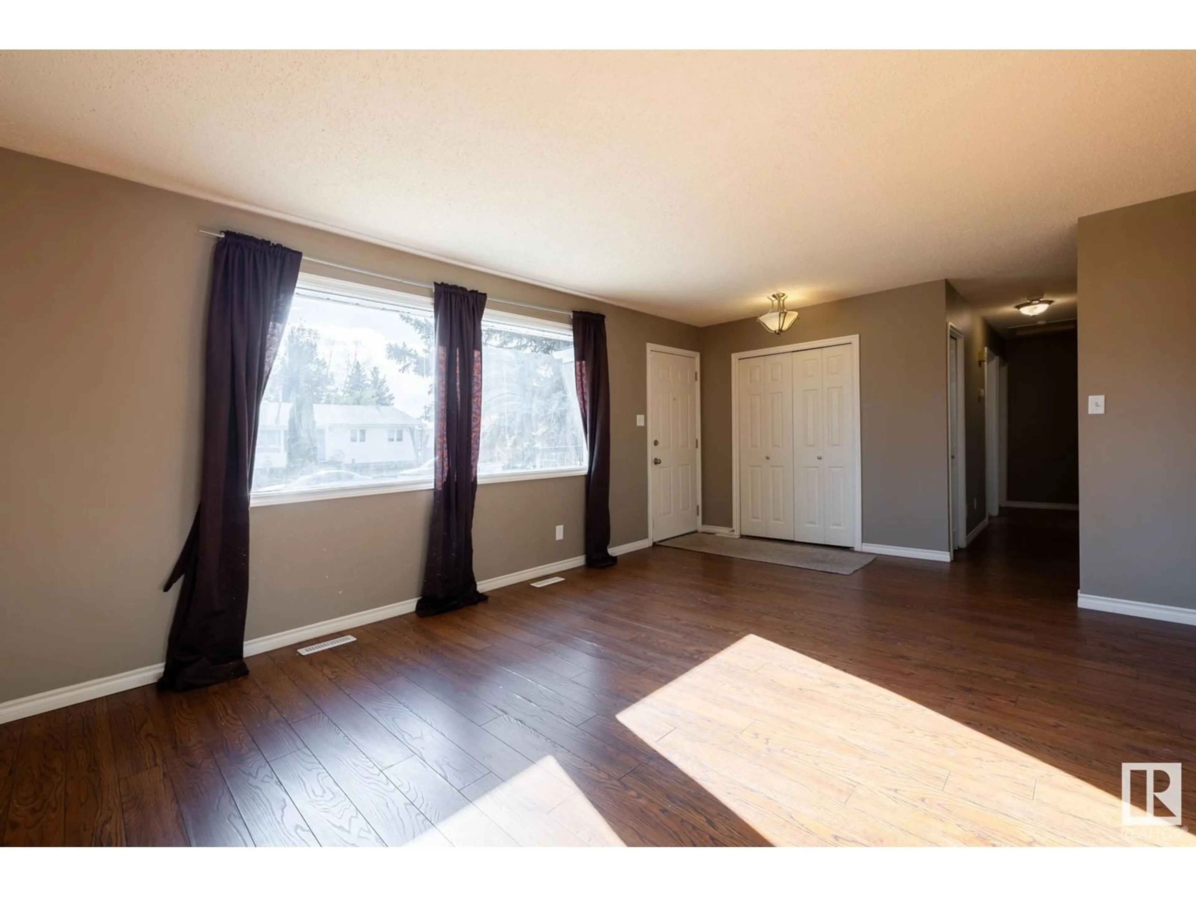 A pic of a room, wood floors for 7416 32 AV NW, Edmonton Alberta T6K1J8