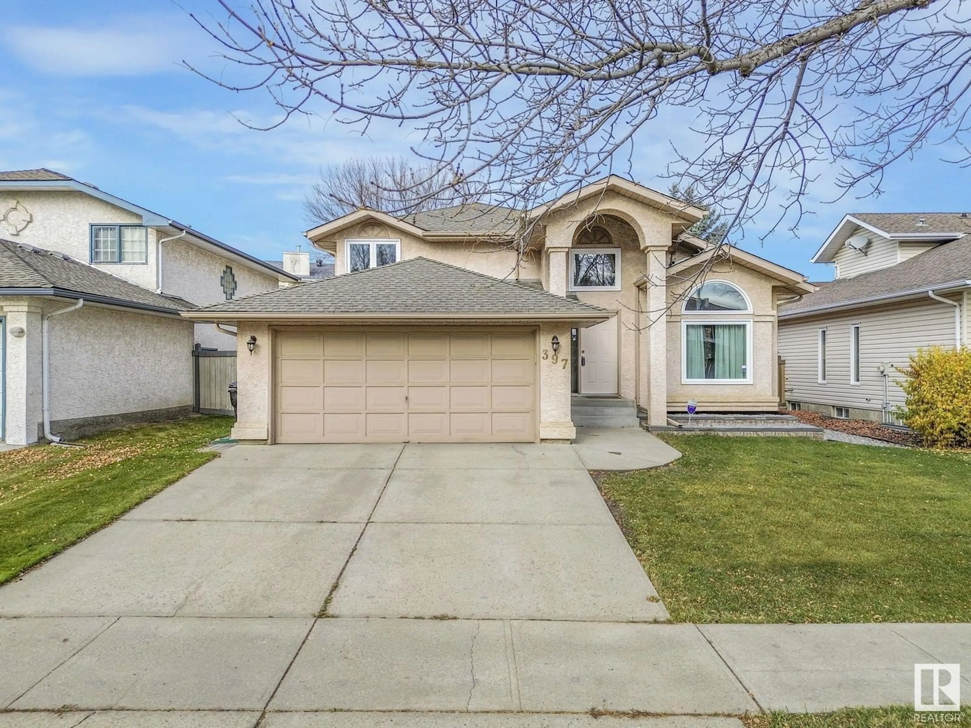 Frontside or backside of a home, the street view for 397 BURTON RD NW, Edmonton Alberta T6R2J4