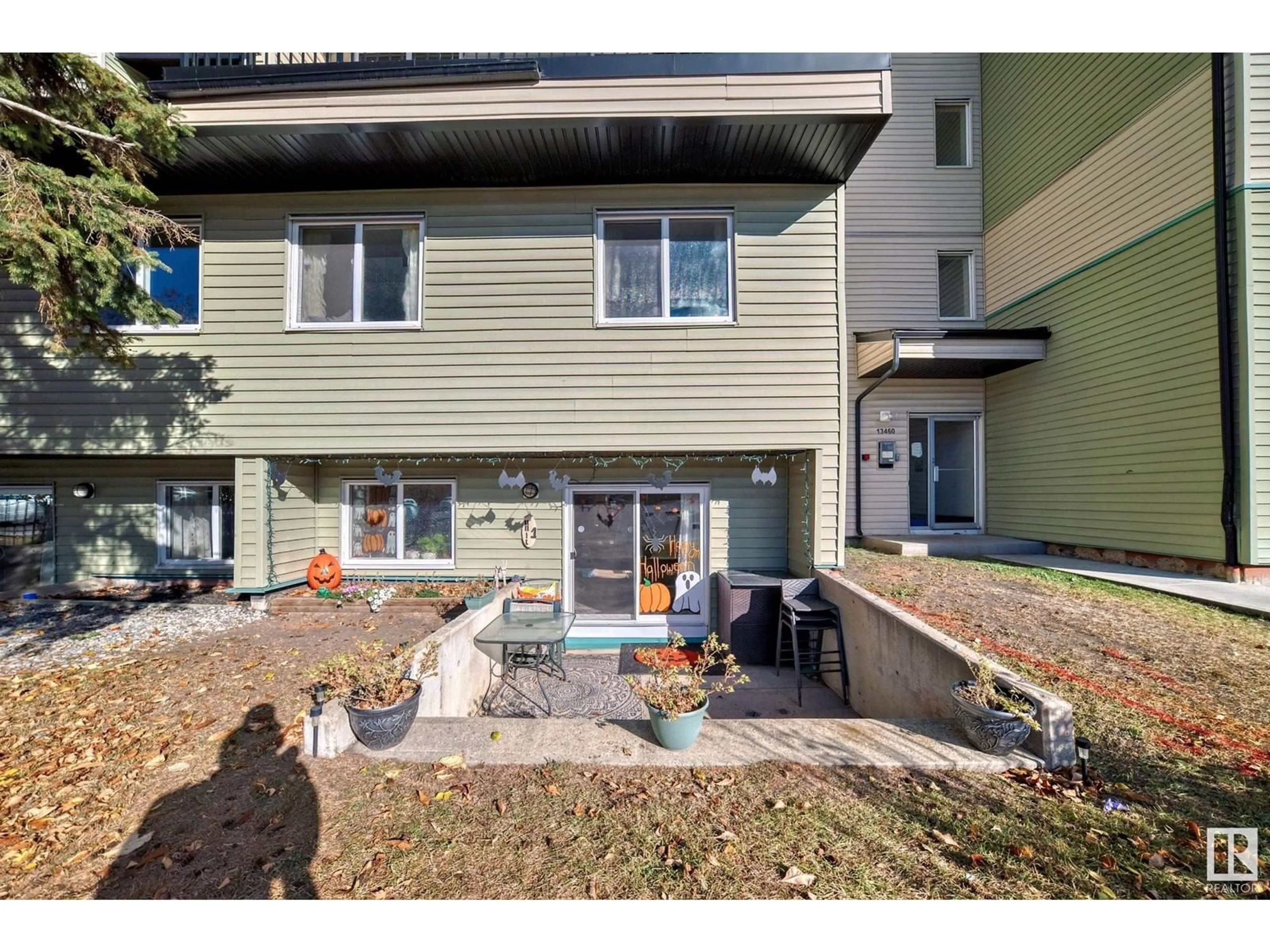 A pic from exterior of the house or condo, the fenced backyard for #1 13460 FORT RD NW, Edmonton Alberta T5A1C5