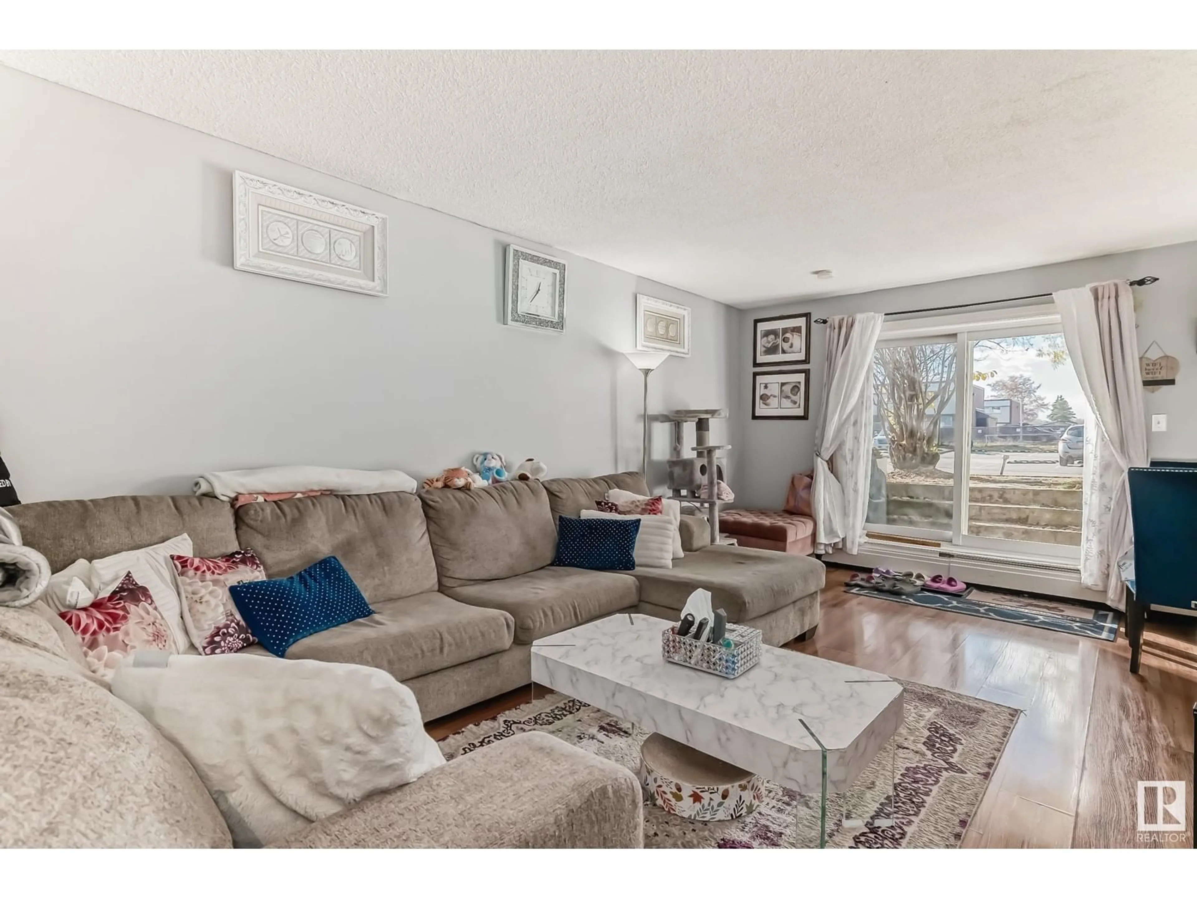 Living room, wood floors for #1 13458 FORT RD NW, Edmonton Alberta T5A1C5