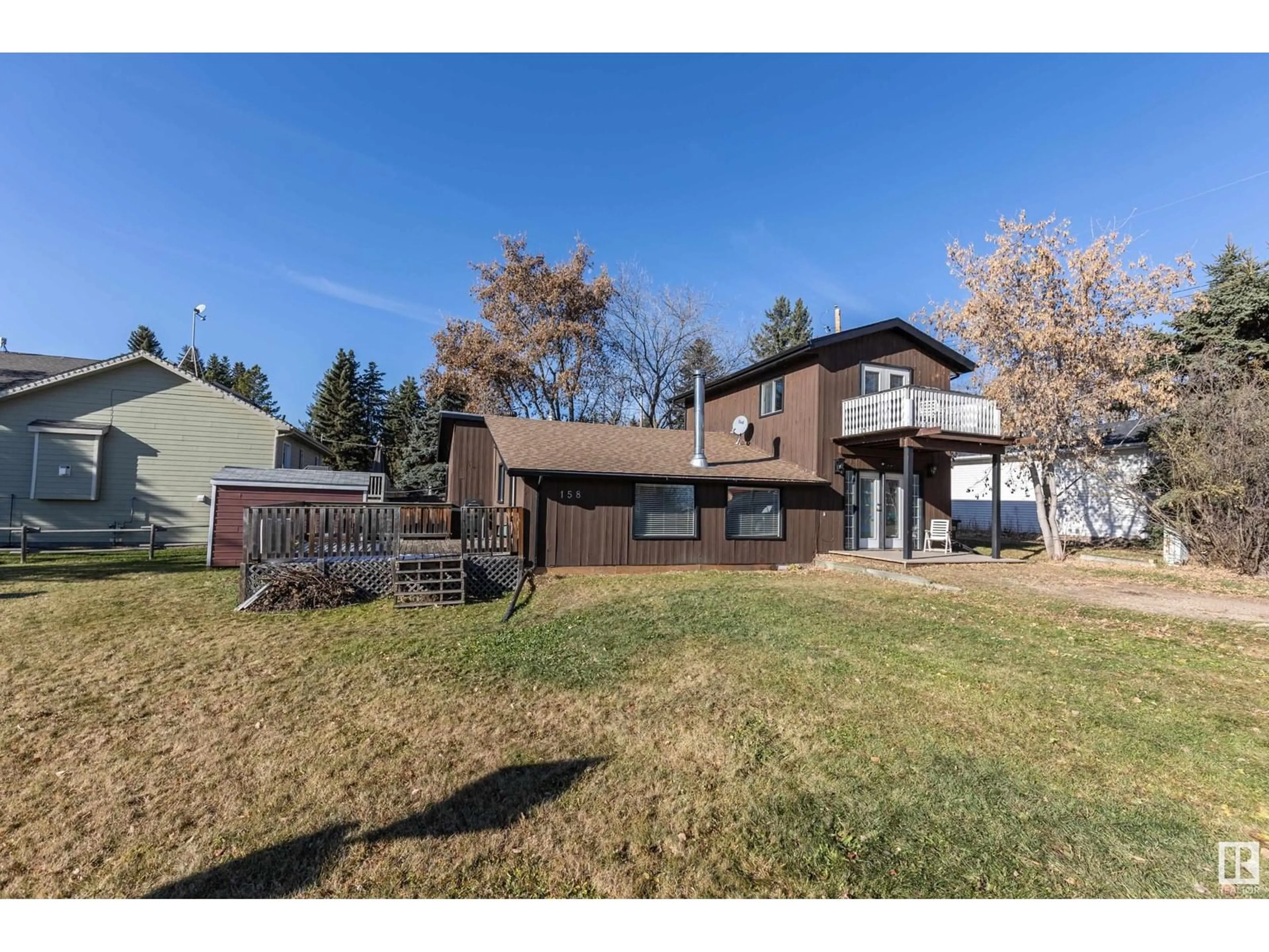 Frontside or backside of a home, the fenced backyard for 158 22106 South Cooking Lake RD, Rural Strathcona County Alberta T5L1A5