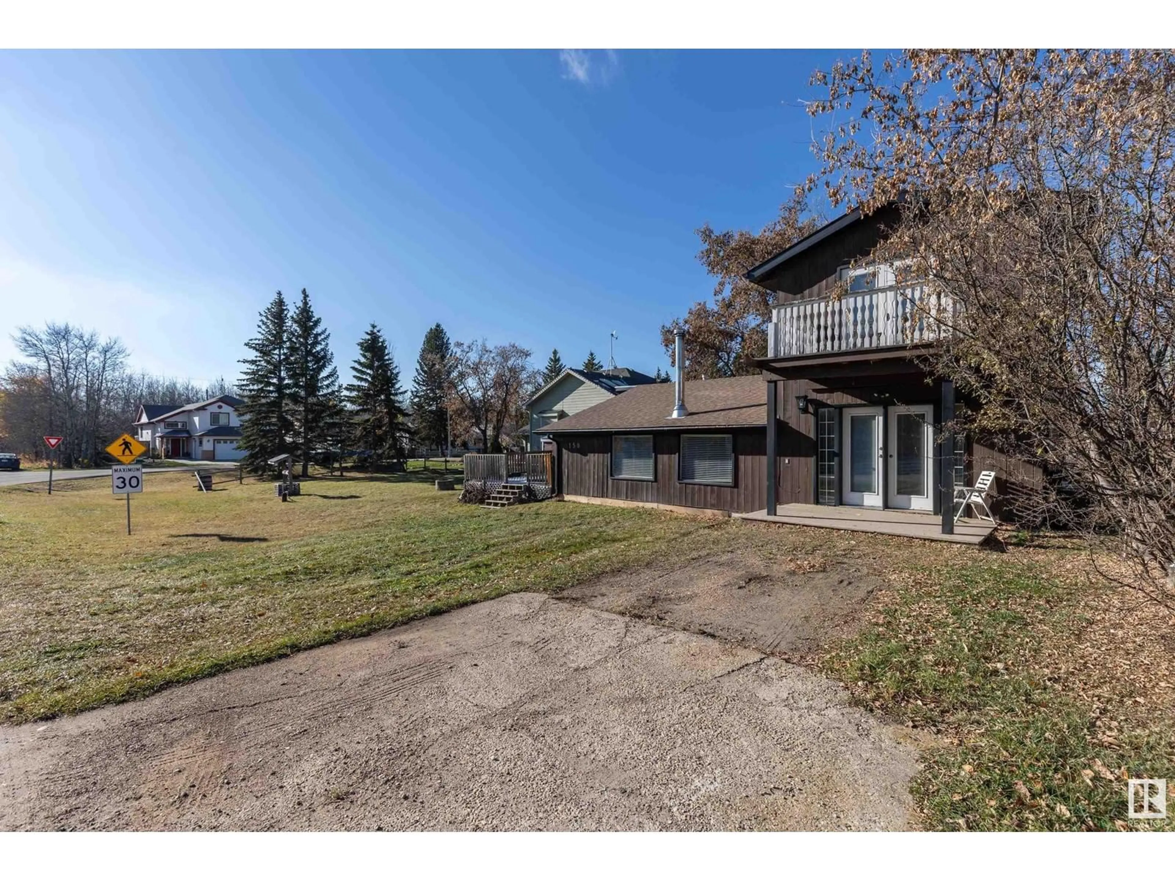 Frontside or backside of a home, the fenced backyard for 158 22106 South Cooking Lake RD, Rural Strathcona County Alberta T5L1A5