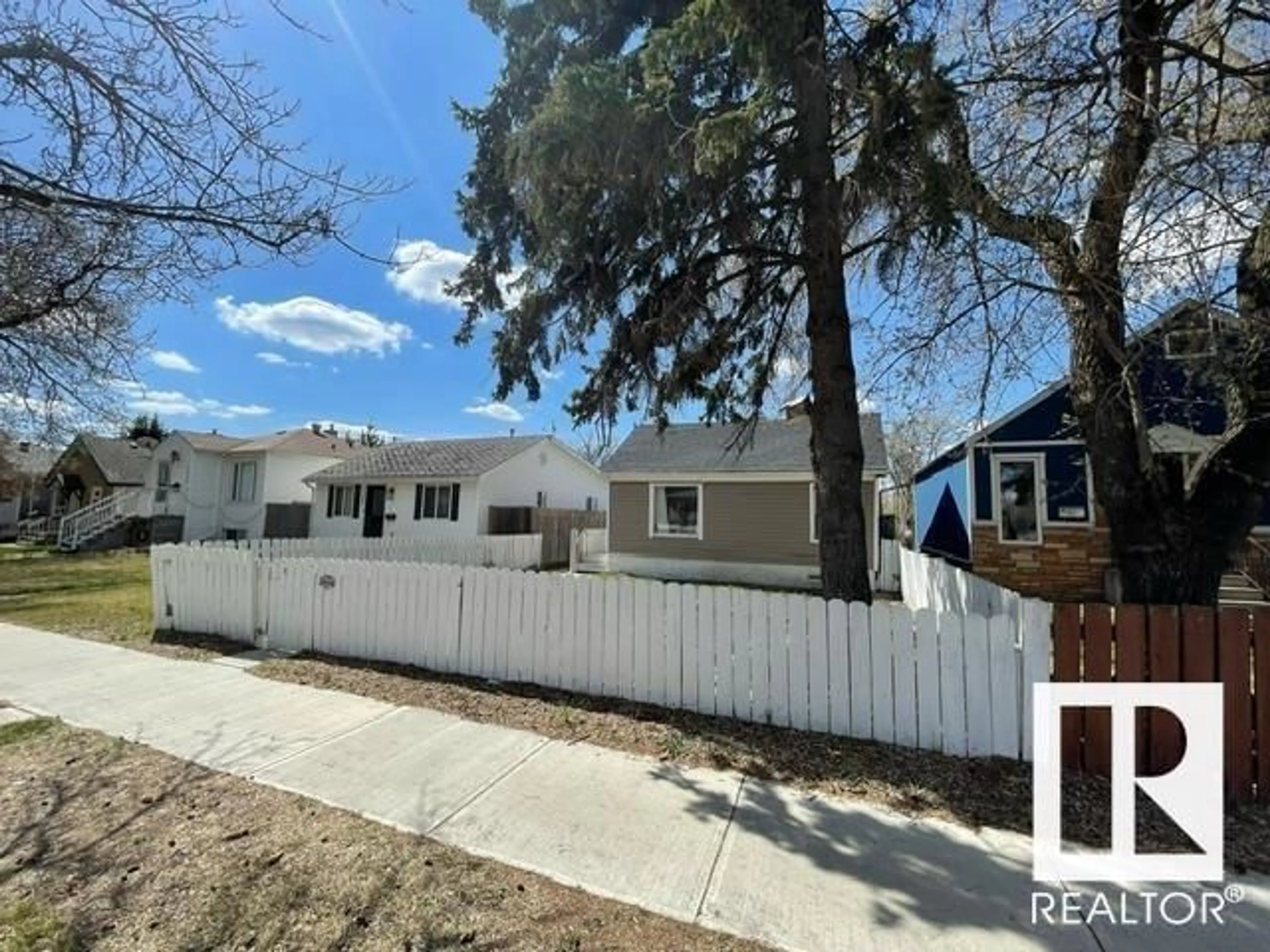 Frontside or backside of a home, the fenced backyard for 11944 77 ST NW, Edmonton Alberta T5B2G4