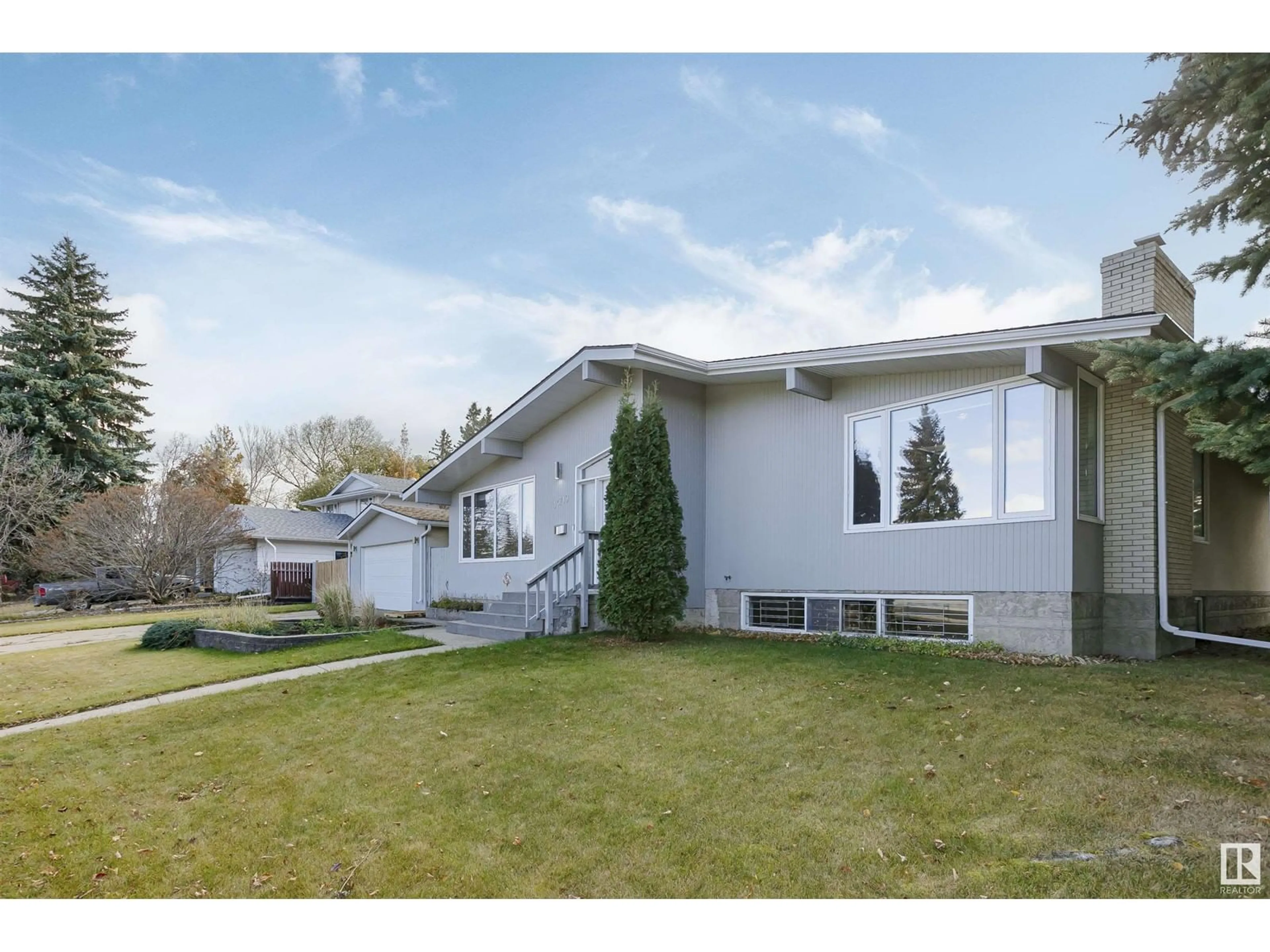 Frontside or backside of a home, the fenced backyard for 14719 59 AV NW, Edmonton Alberta T6H4T5