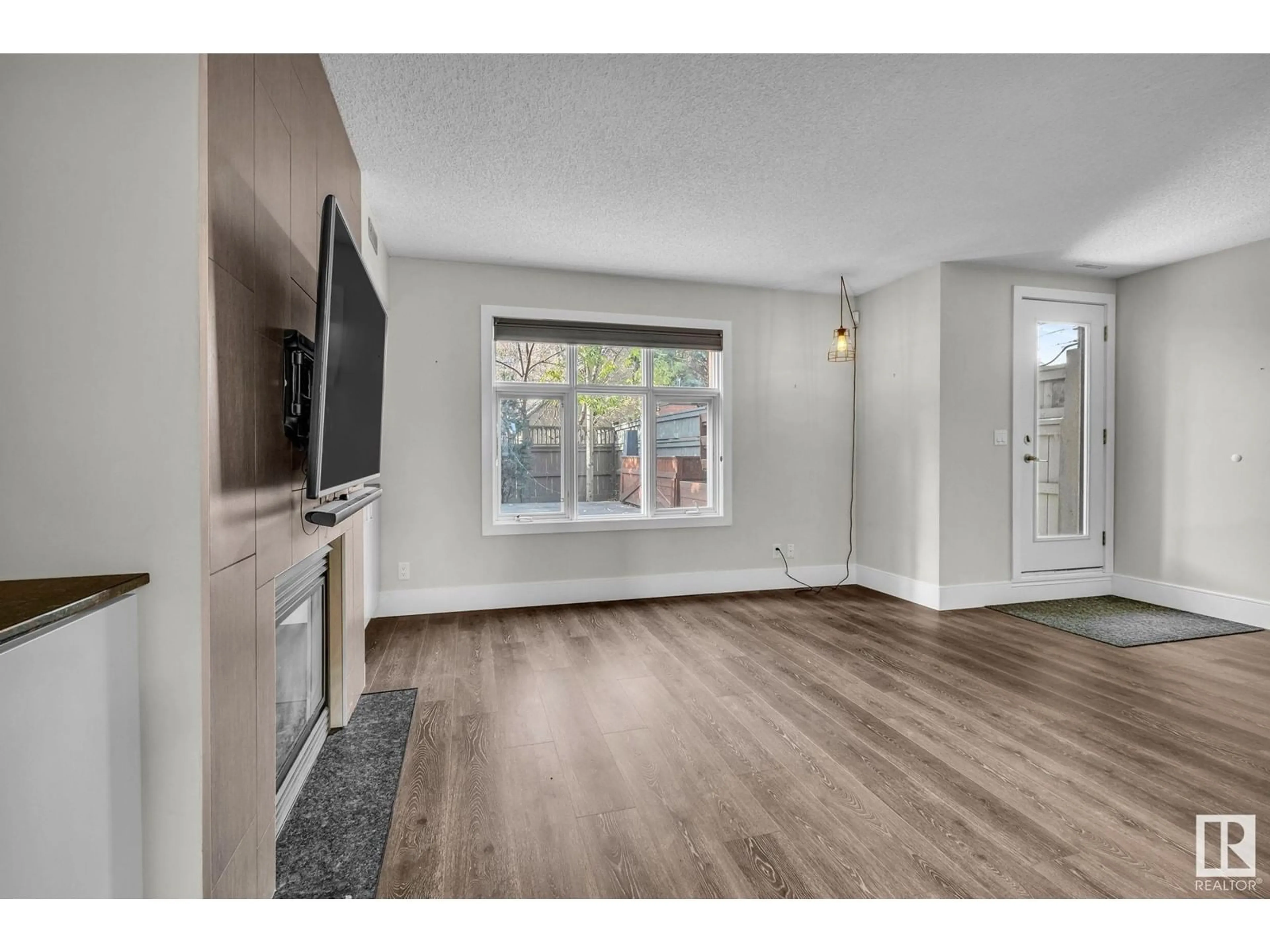 A pic of a room, wood floors for #6 9026 JASPER AV NW, Edmonton Alberta T5H3S8