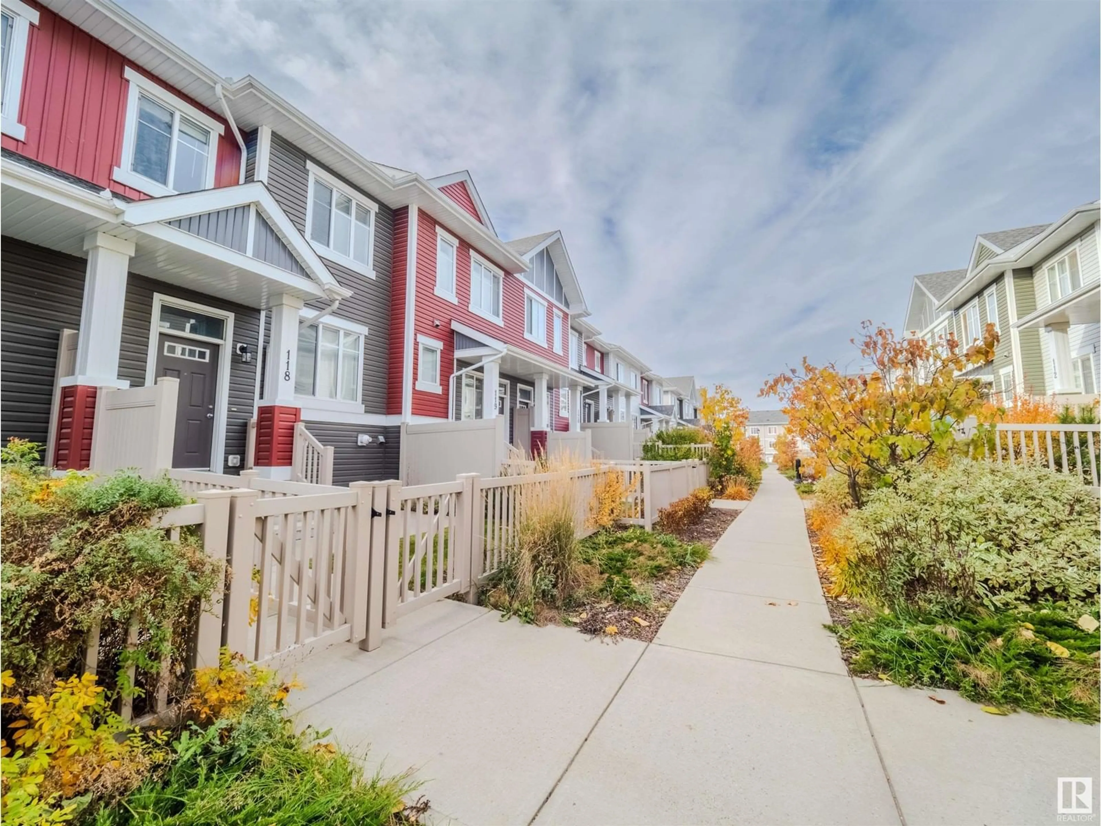 A pic from exterior of the house or condo, the fenced backyard for #118 2905 141 ST SW, Edmonton Alberta T6W3M4