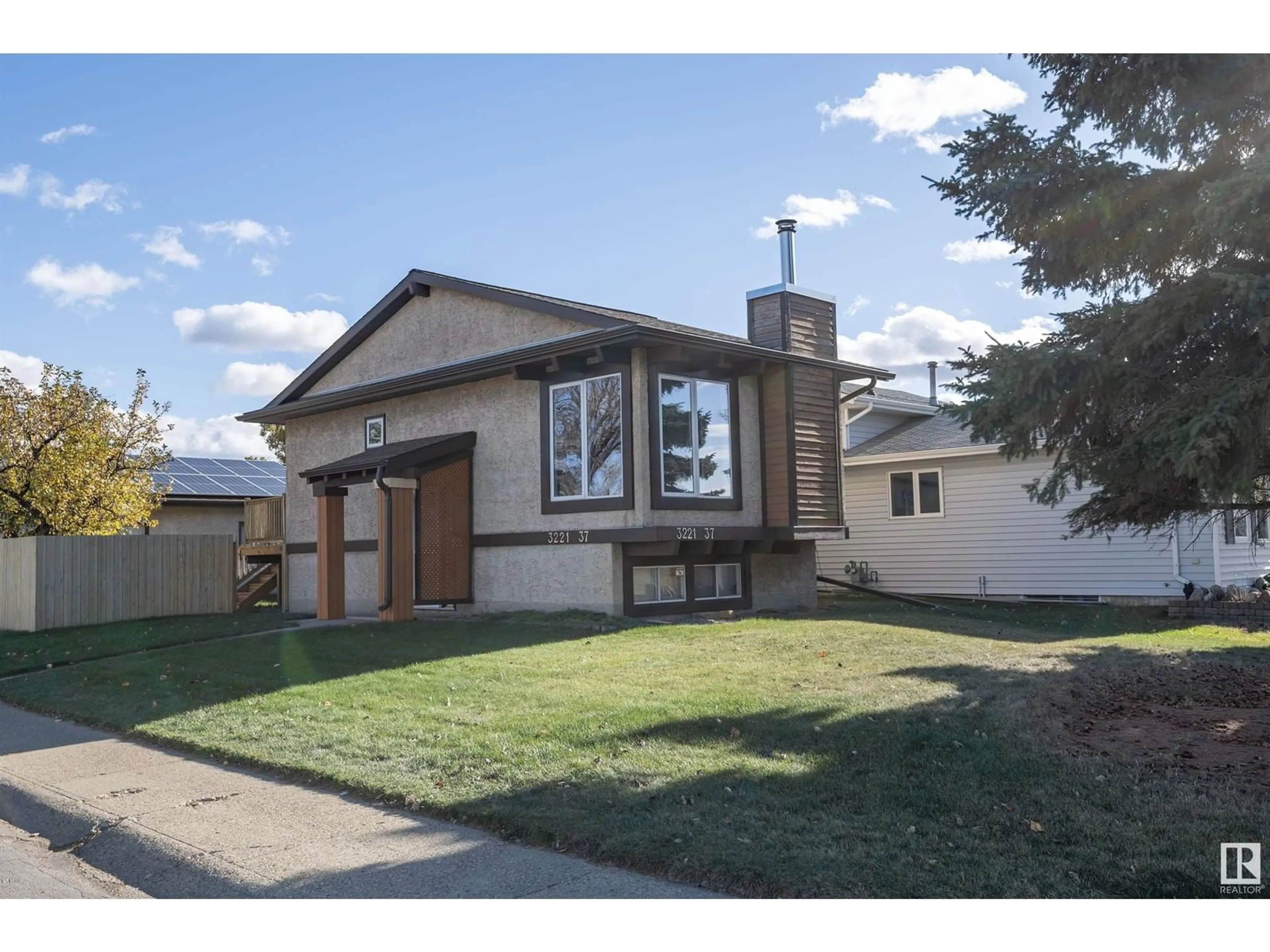 Frontside or backside of a home, the street view for 3221 37 ST NW, Edmonton Alberta T6L5R1