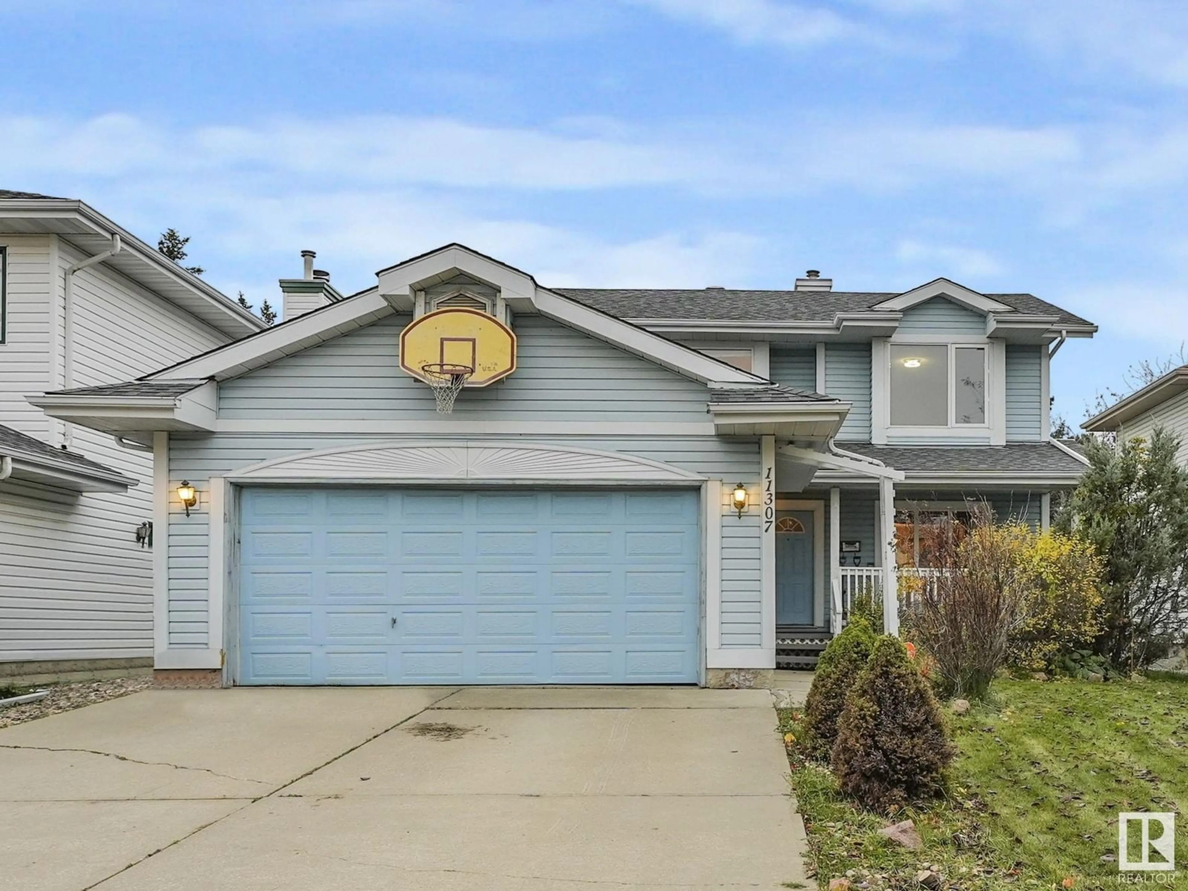 Frontside or backside of a home, the street view for 11307 10 AV NW, Edmonton Alberta T6J6S2