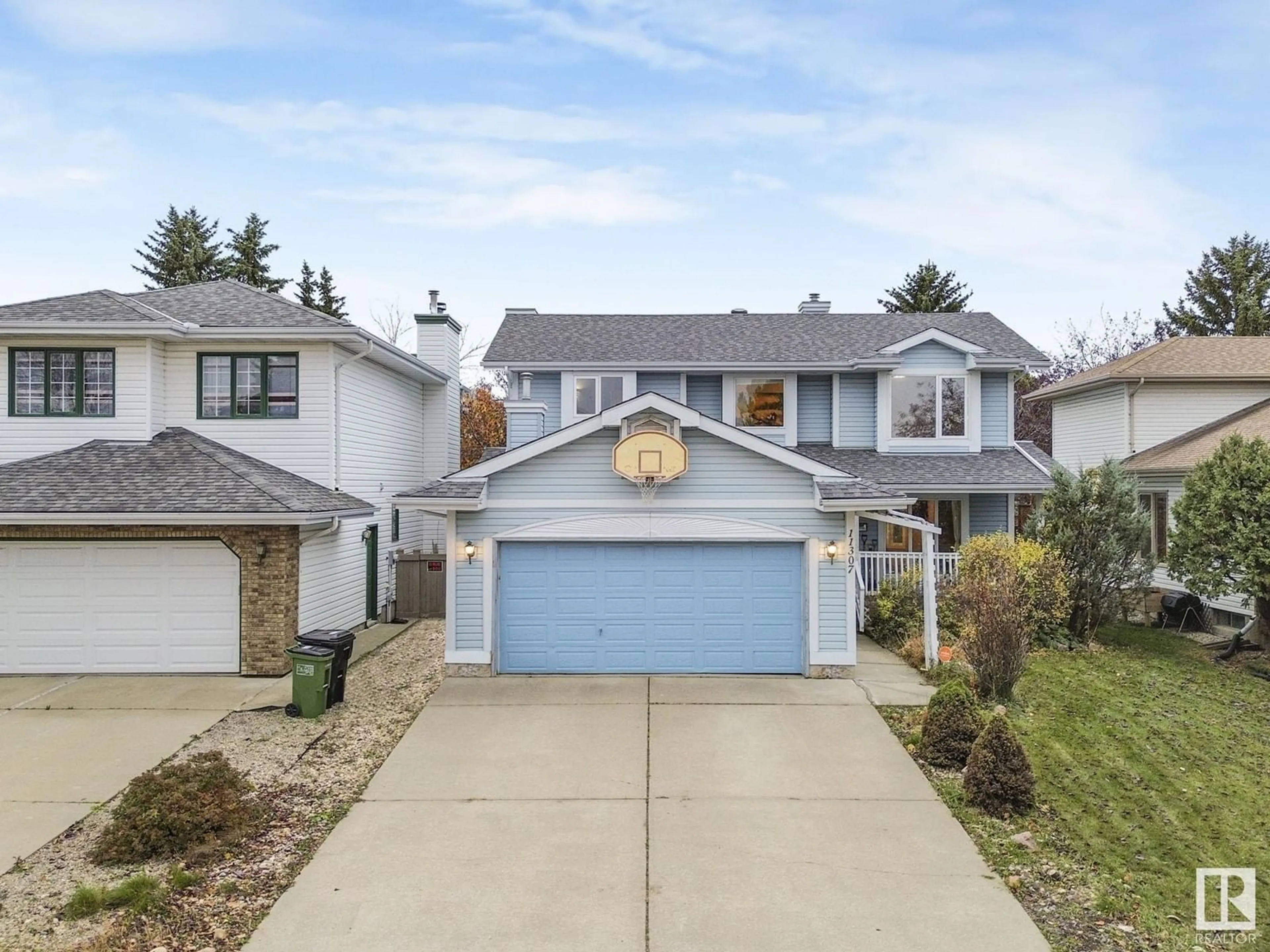 Frontside or backside of a home, the street view for 11307 10 AV NW, Edmonton Alberta T6J6S2