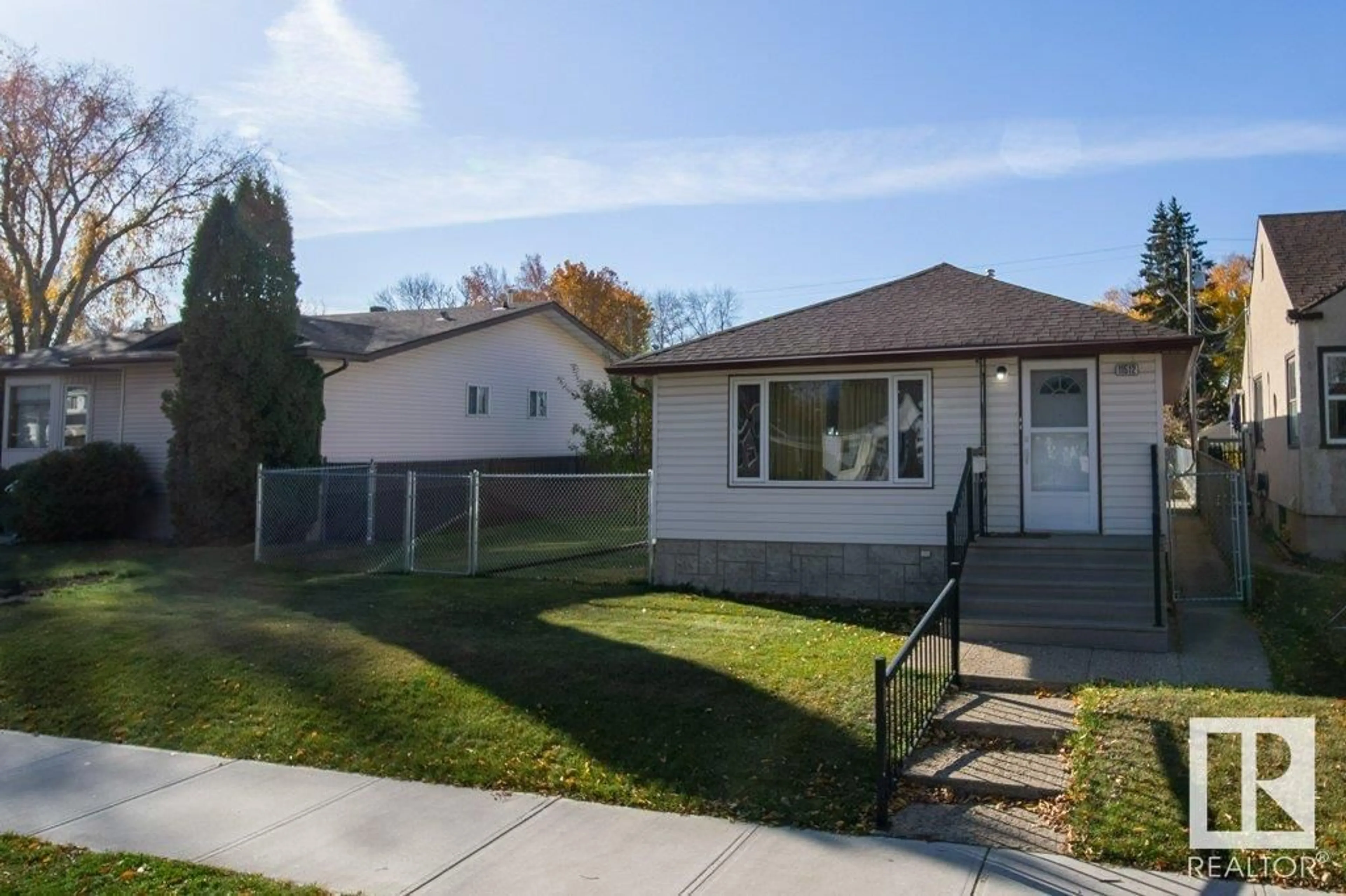 Frontside or backside of a home, the fenced backyard for 11512 67 ST NW, Edmonton Alberta T5B1L7