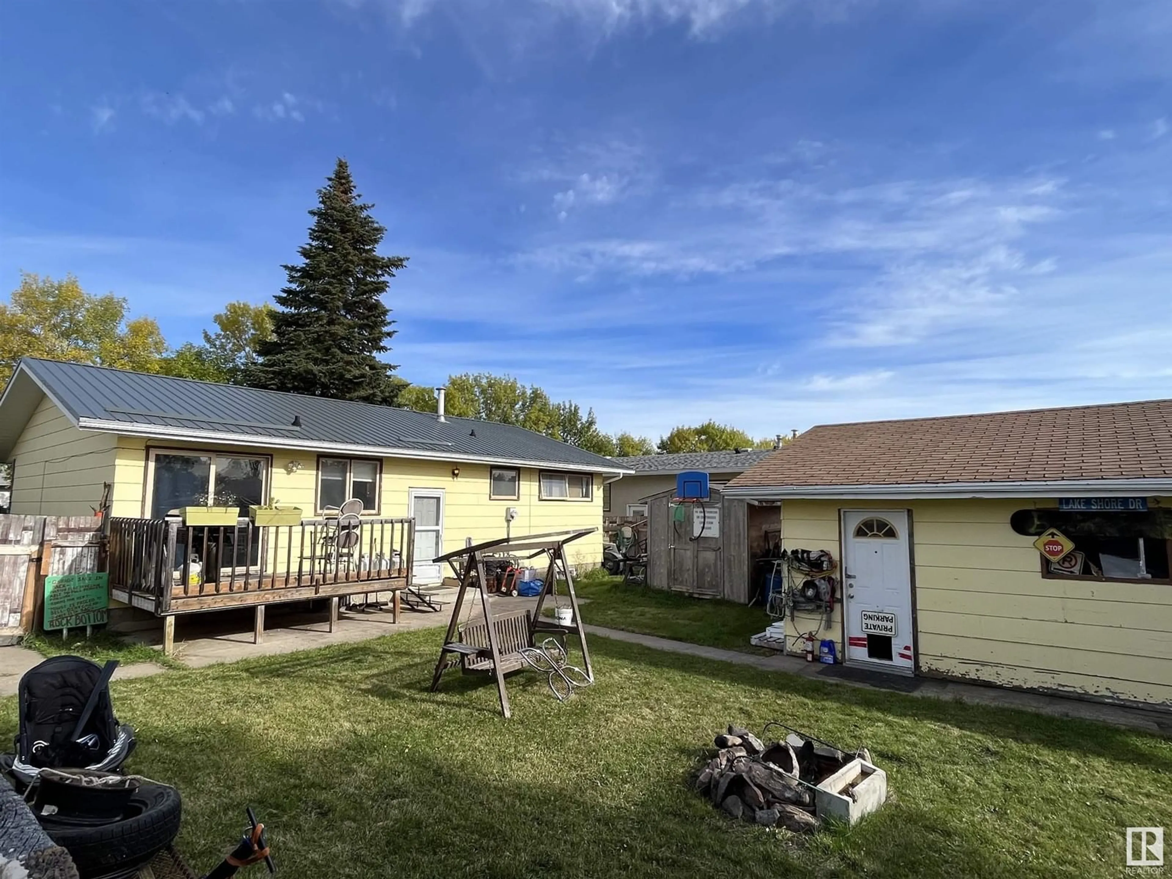 Frontside or backside of a home, the fenced backyard for 4418 45 AV, Bonnyville Town Alberta T9N1X5