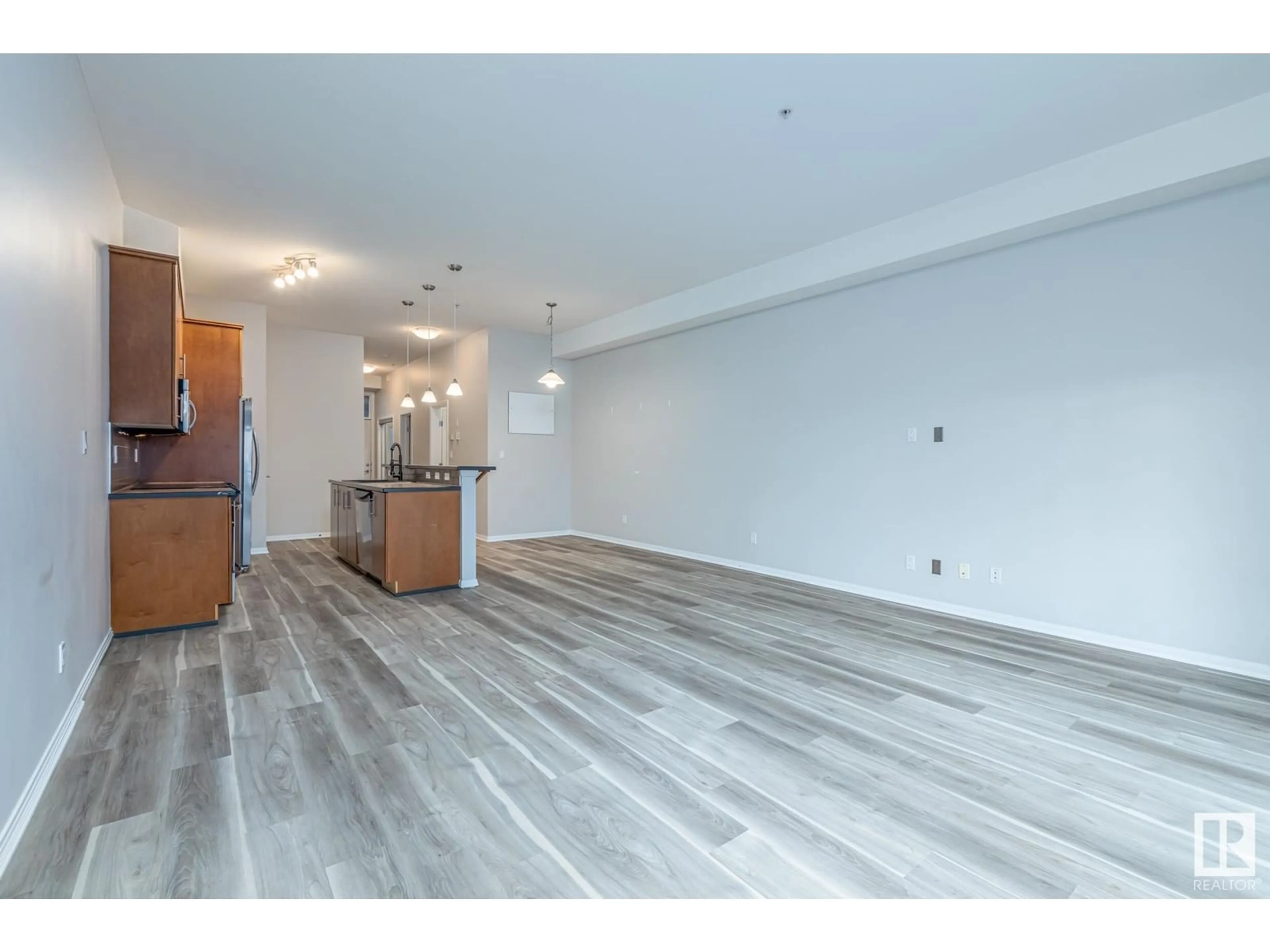 A pic of a room, wood floors for #220 10531 117 ST NW, Edmonton Alberta T5H3L7