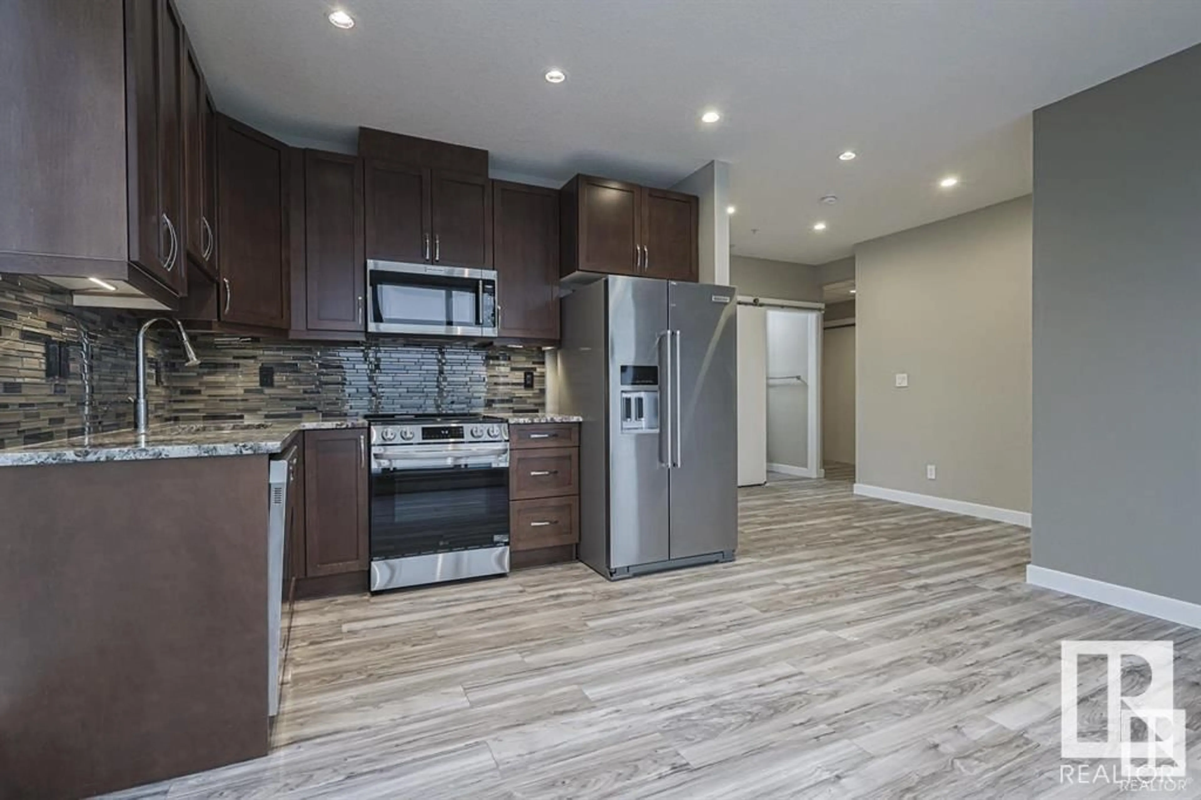 Open concept kitchen for #1903 10238 103 ST NW NW, Edmonton Alberta T5J0G8