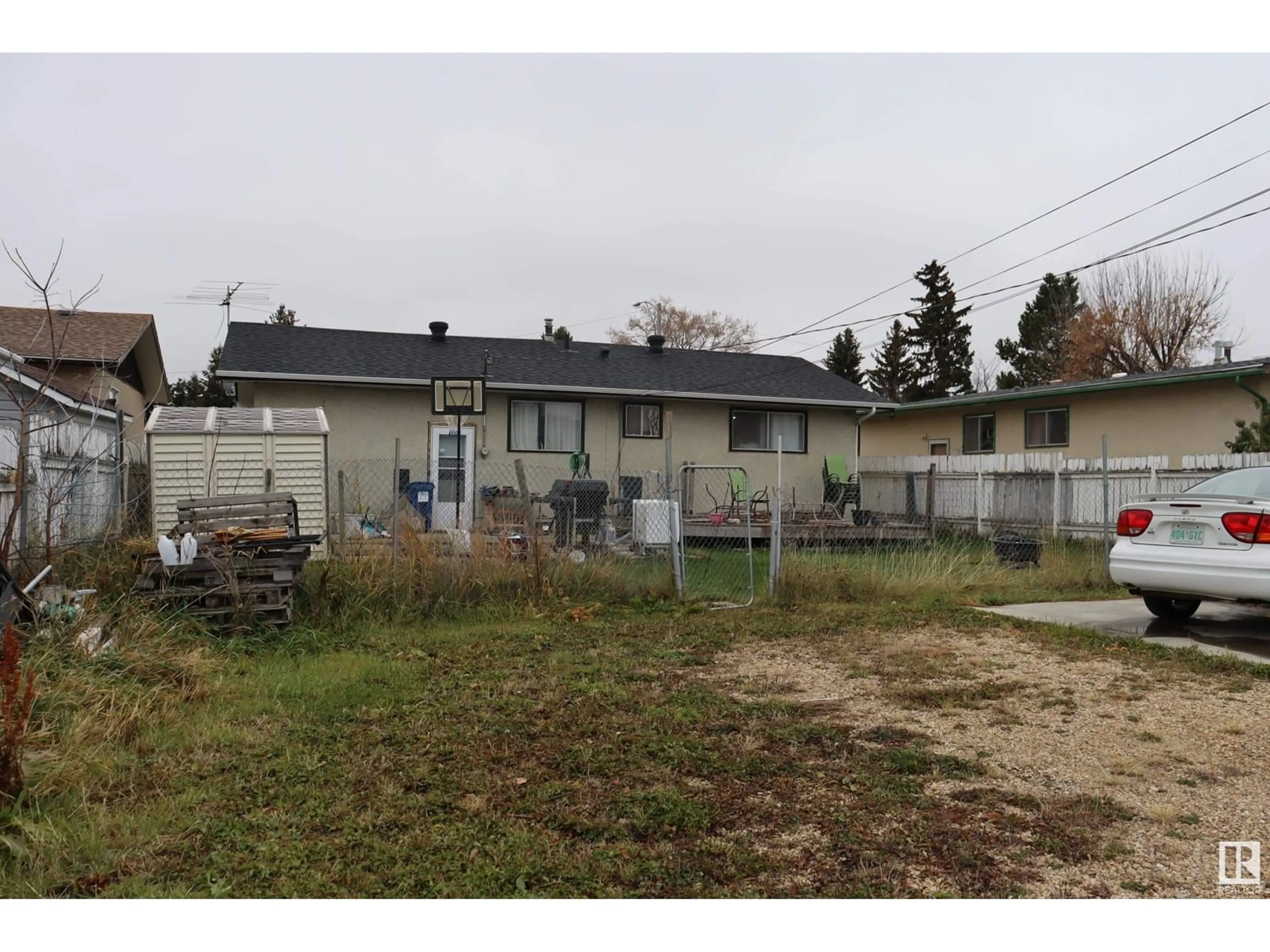 Frontside or backside of a home, the fenced backyard for 4616 45 Ave, Wetaskiwin Alberta T9A0E1