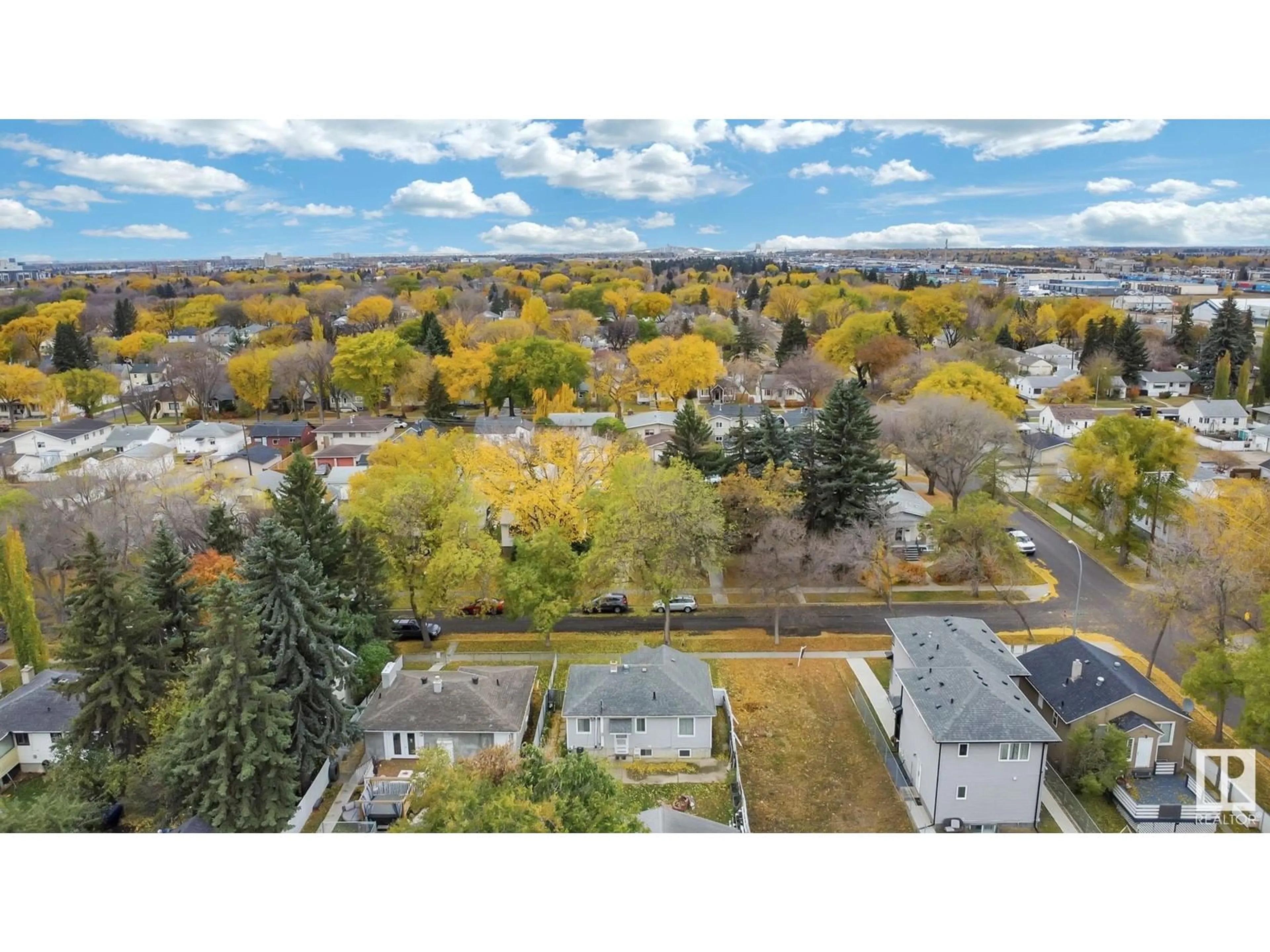 A pic from exterior of the house or condo, the fenced backyard for 12335 90 ST NW, Edmonton Alberta T5B3Z6