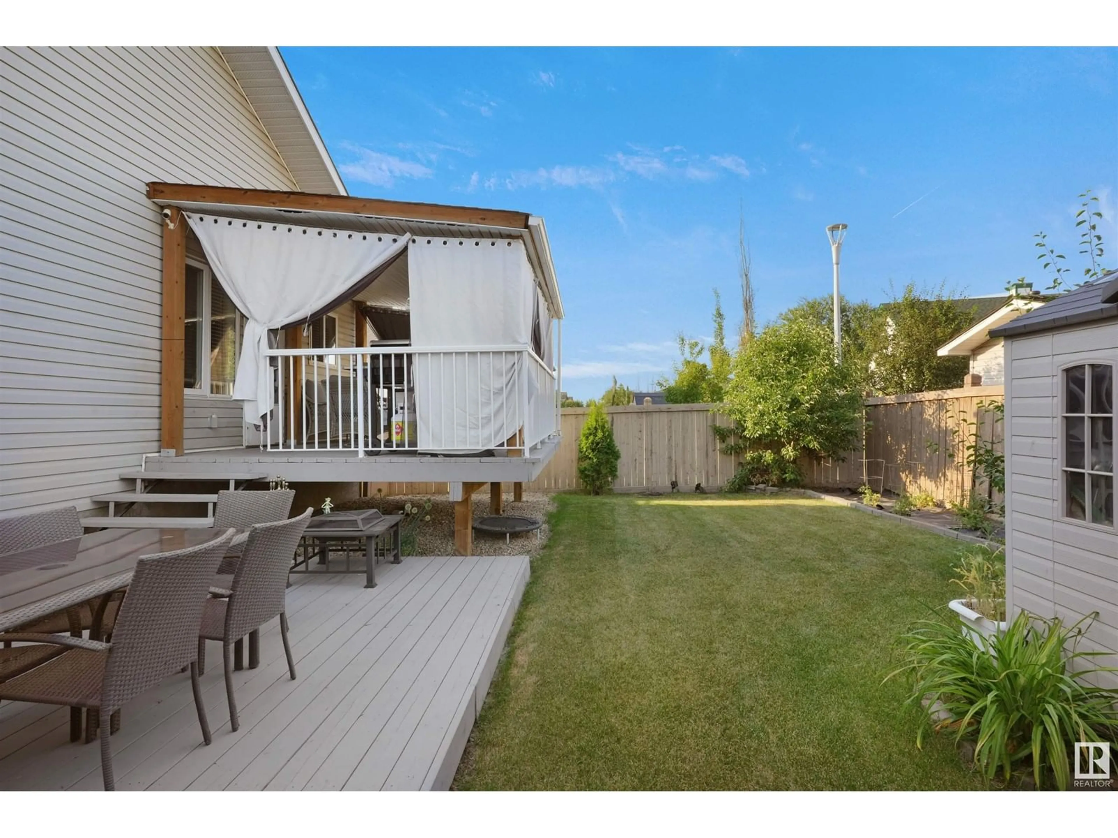 Patio, the fenced backyard for 14043 134 ST NW, Edmonton Alberta T6V1W3