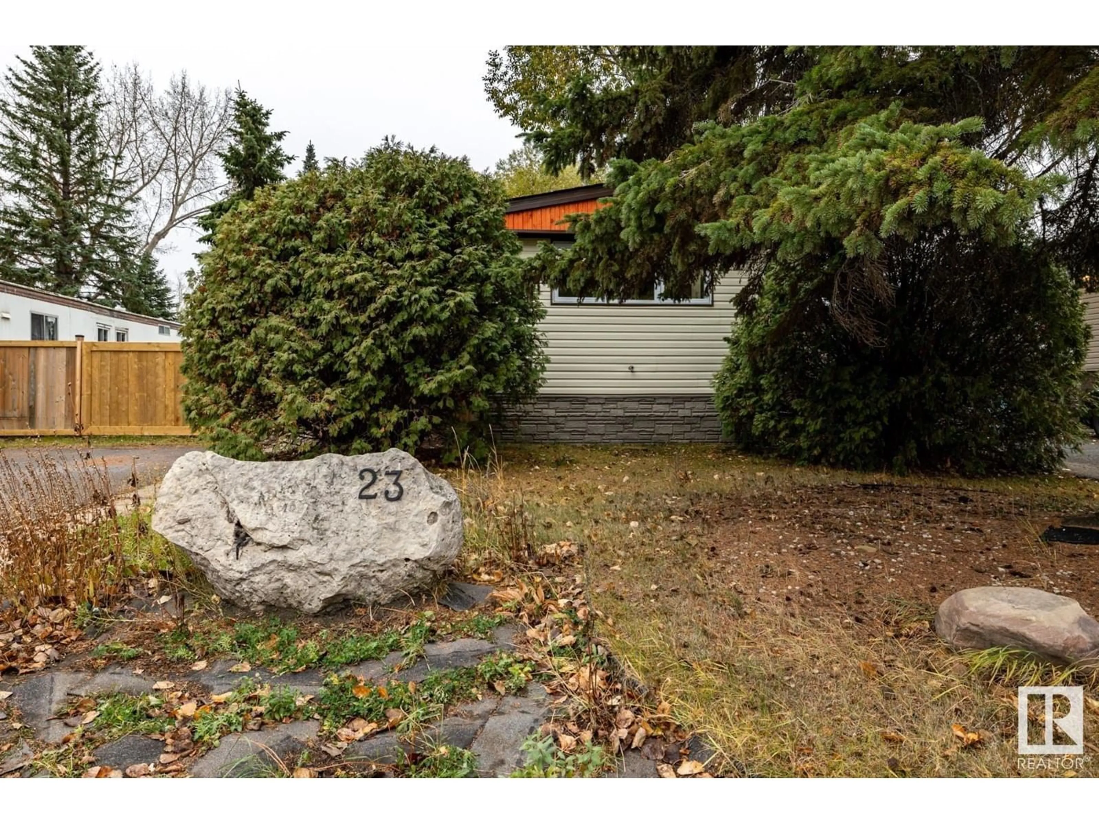 Frontside or backside of a home, the fenced backyard for 23 The Pkwy NW, Edmonton Alberta T6P1E1