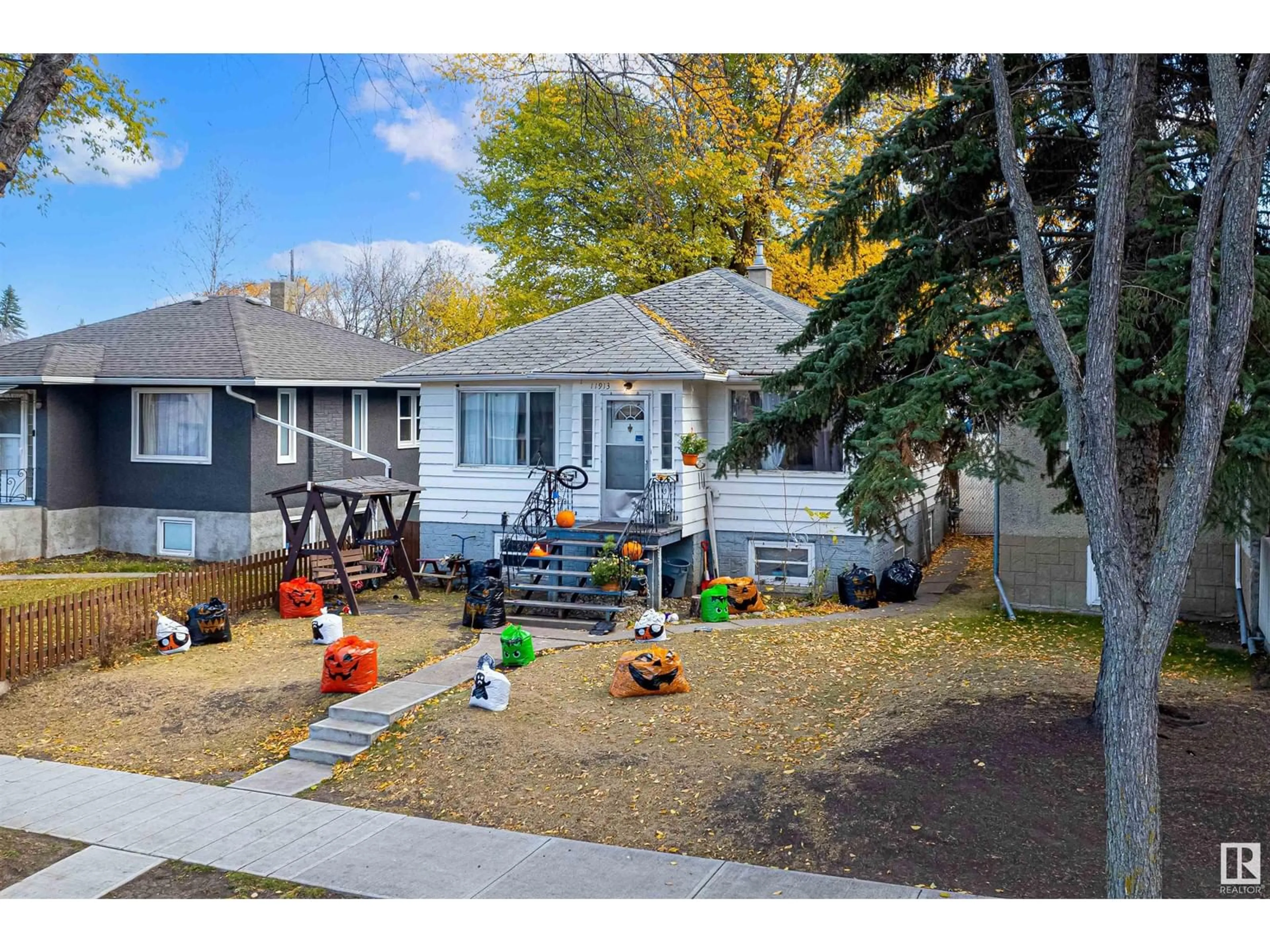 Frontside or backside of a home, the fenced backyard for 11913 70 ST NW, Edmonton Alberta T5B1V1