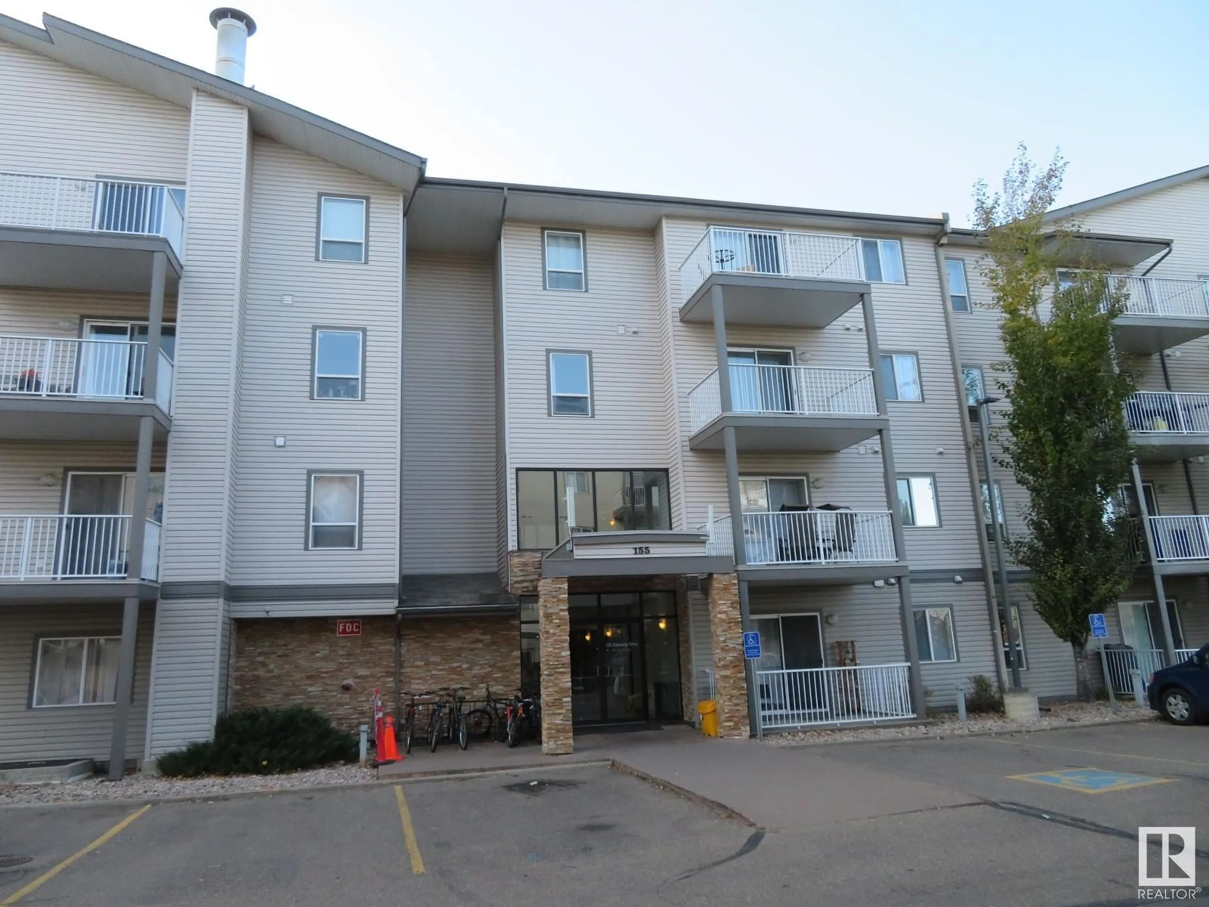 A pic from exterior of the house or condo, the front or back of building for #117 155 EDWARDS DR SW, Edmonton Alberta T6X1N6