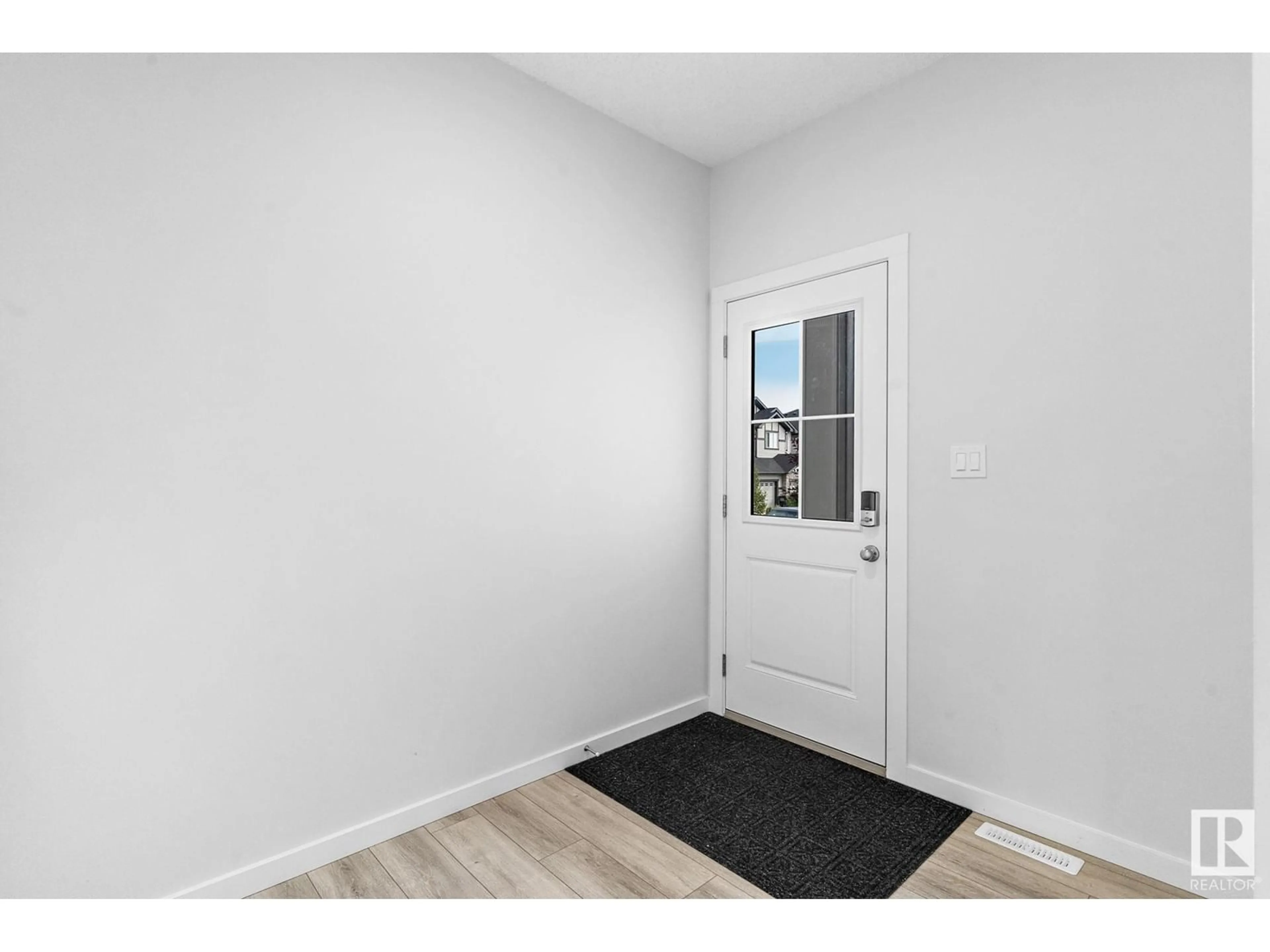 Indoor entryway, wood floors for 7340 CHIVERS CR SW, Edmonton Alberta T6W4M1