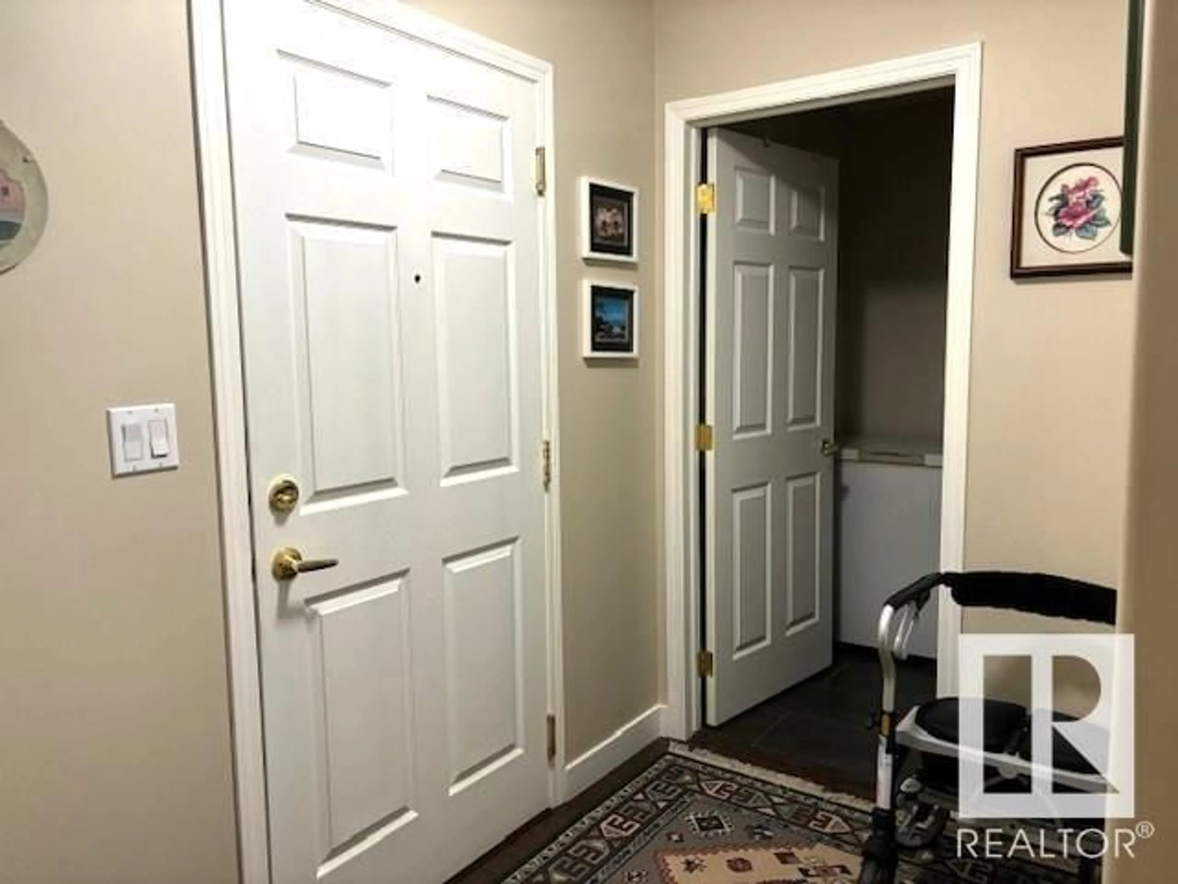 Indoor entryway, wood floors for #101 5106 49 AV, Leduc Alberta T9E8H2