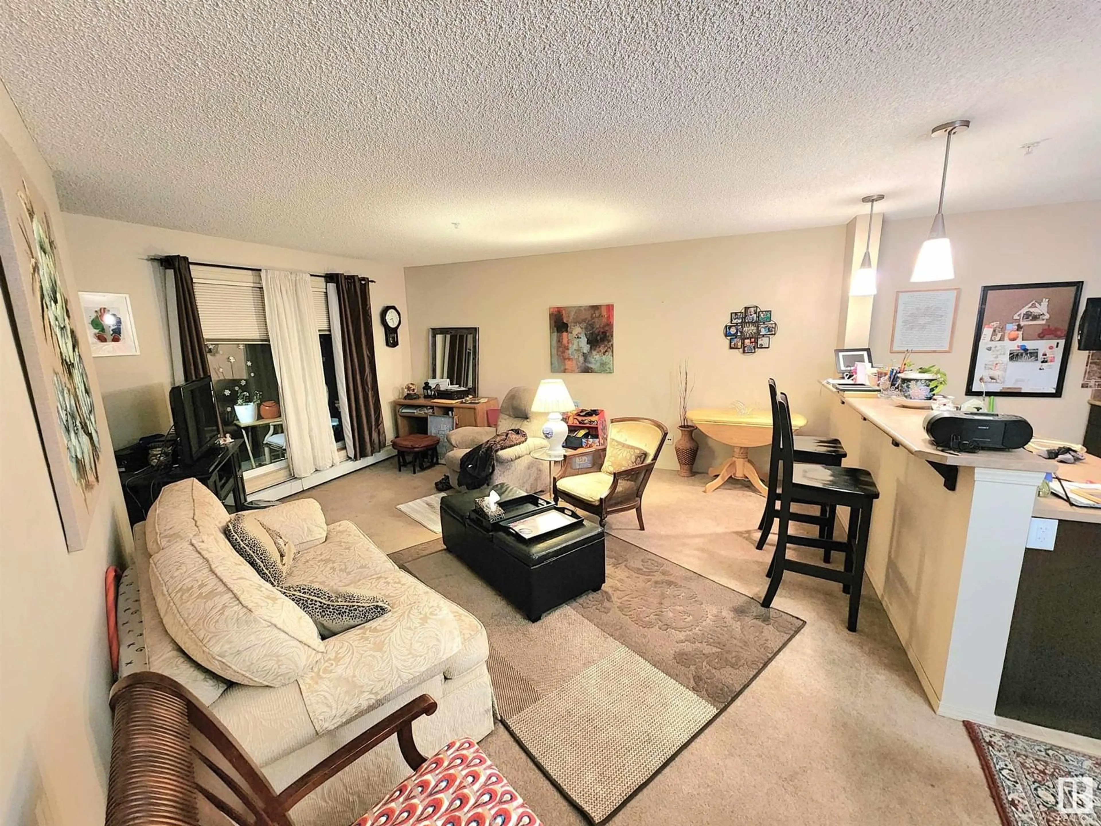 Living room, carpet floors for #138 1180 HYNDMAN RD NW, Edmonton Alberta T5A0P8