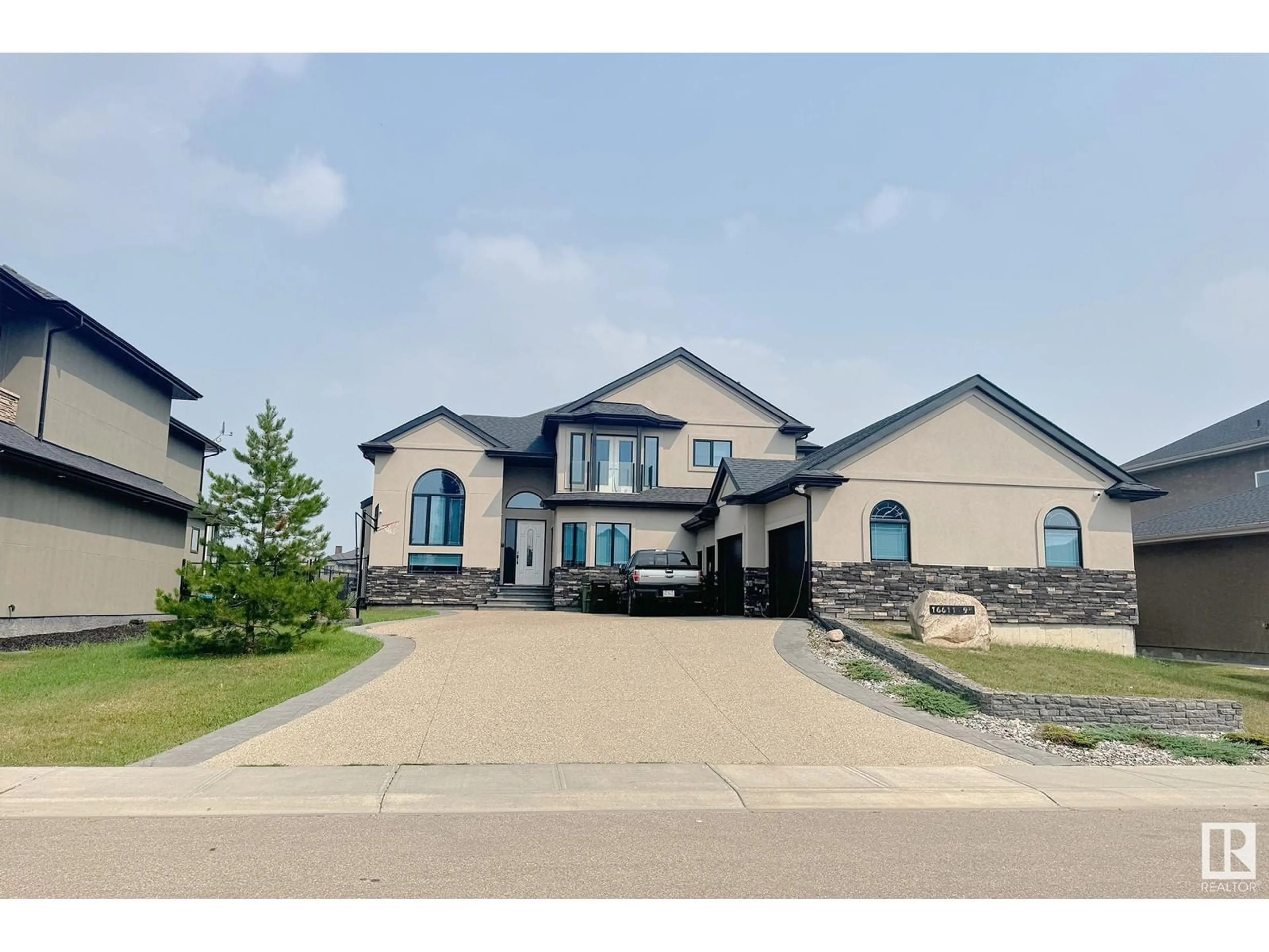 Frontside or backside of a home, the street view for 16611 9 St NE, Edmonton Alberta T5Y0P6