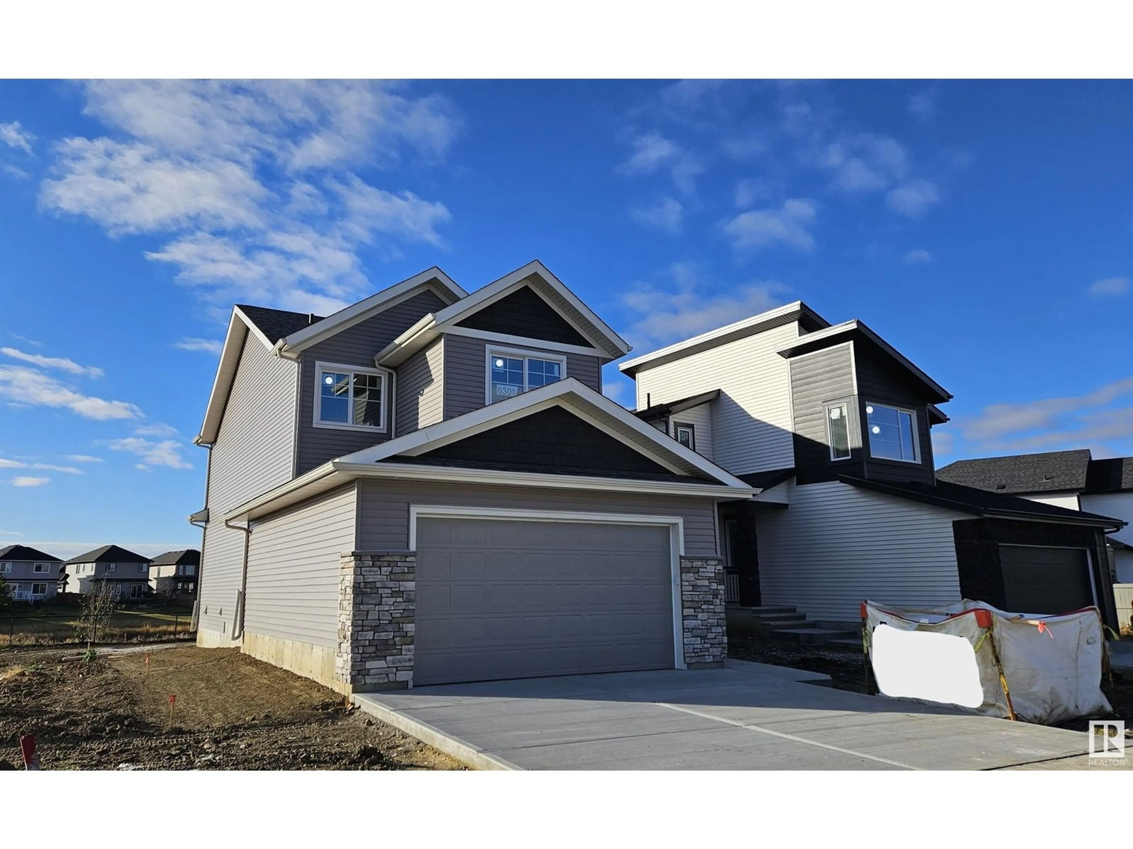 Frontside or backside of a home, the street view for 6301 DANSEREAU CR, Beaumont Alberta T4X3E1