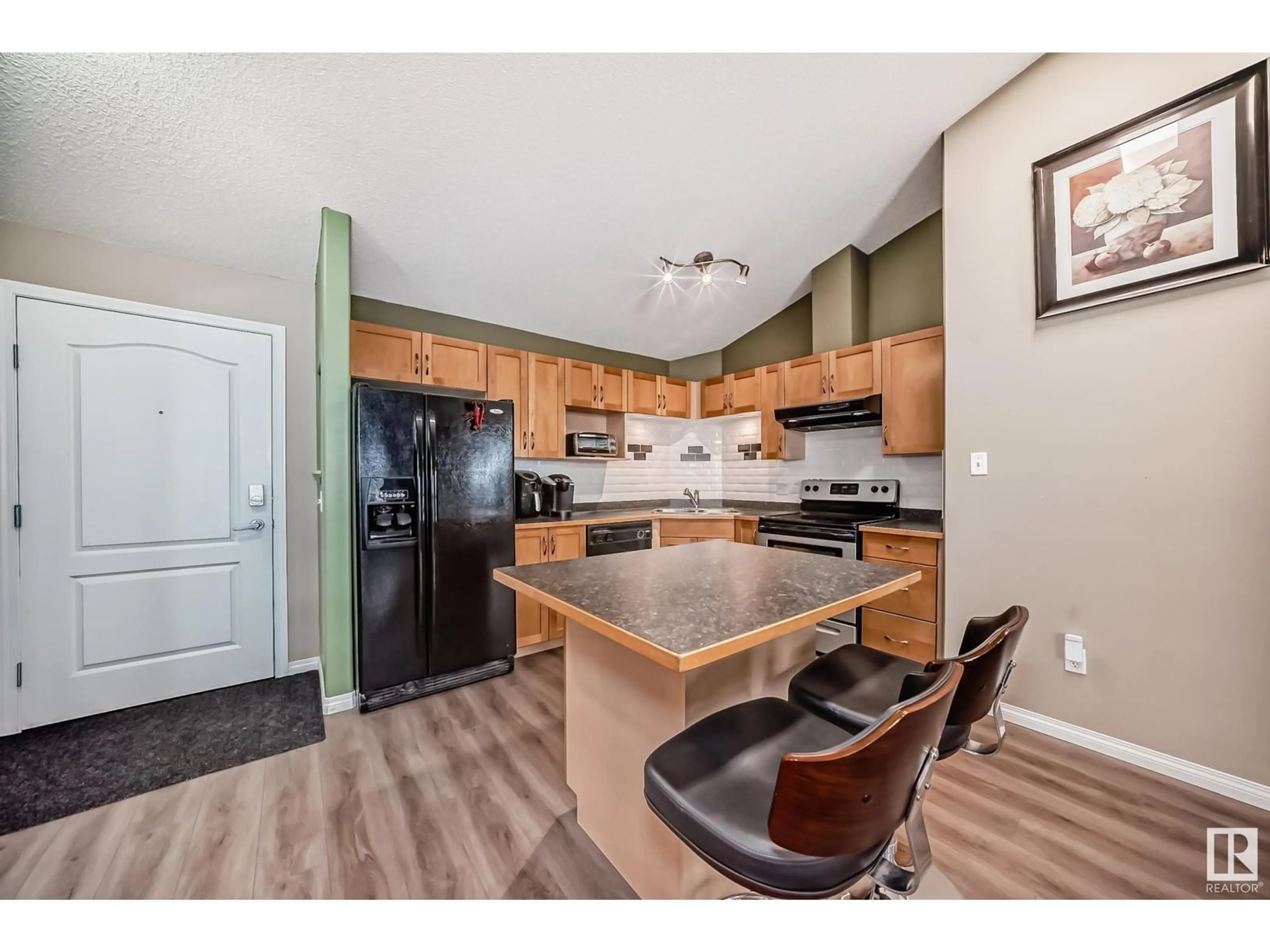 Open concept kitchen for #403 5340 199 ST NW, Edmonton Alberta T6M0A5