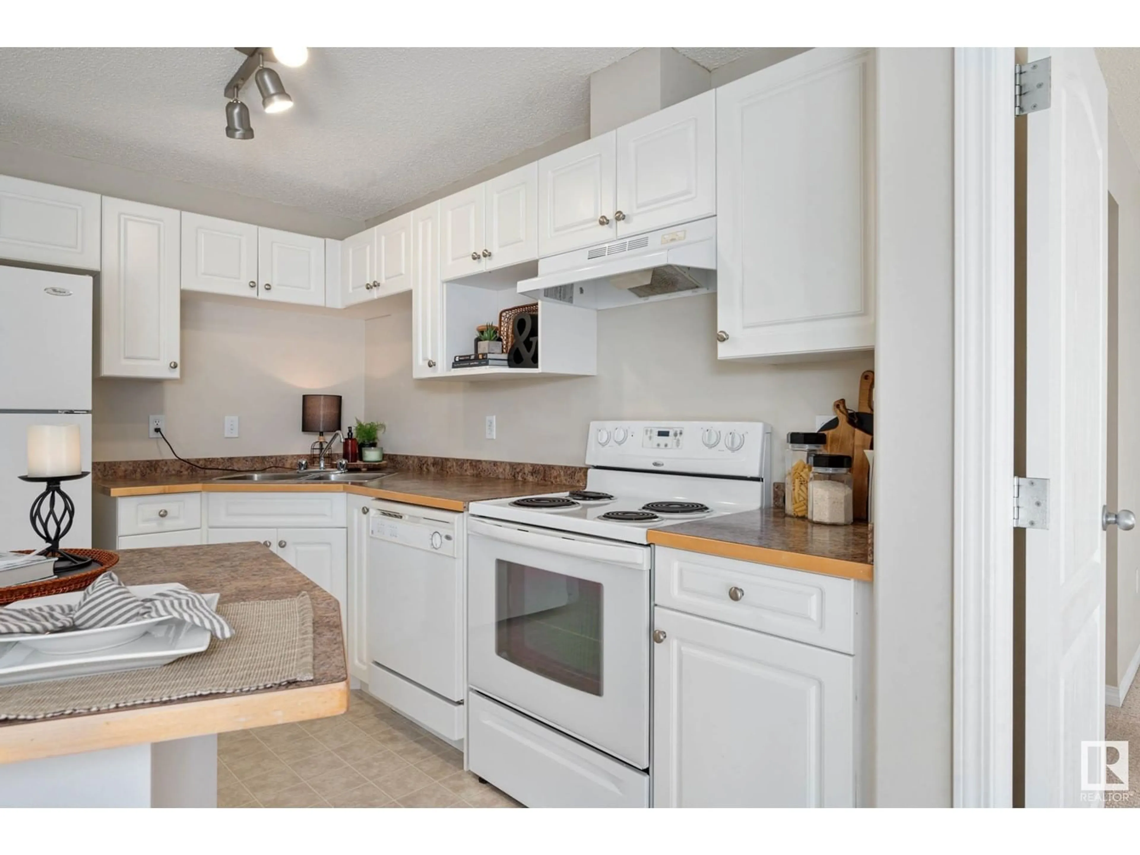 Standard kitchen, wood floors for #211 155 EDWARDS DR SW, Edmonton Alberta T6X1N6