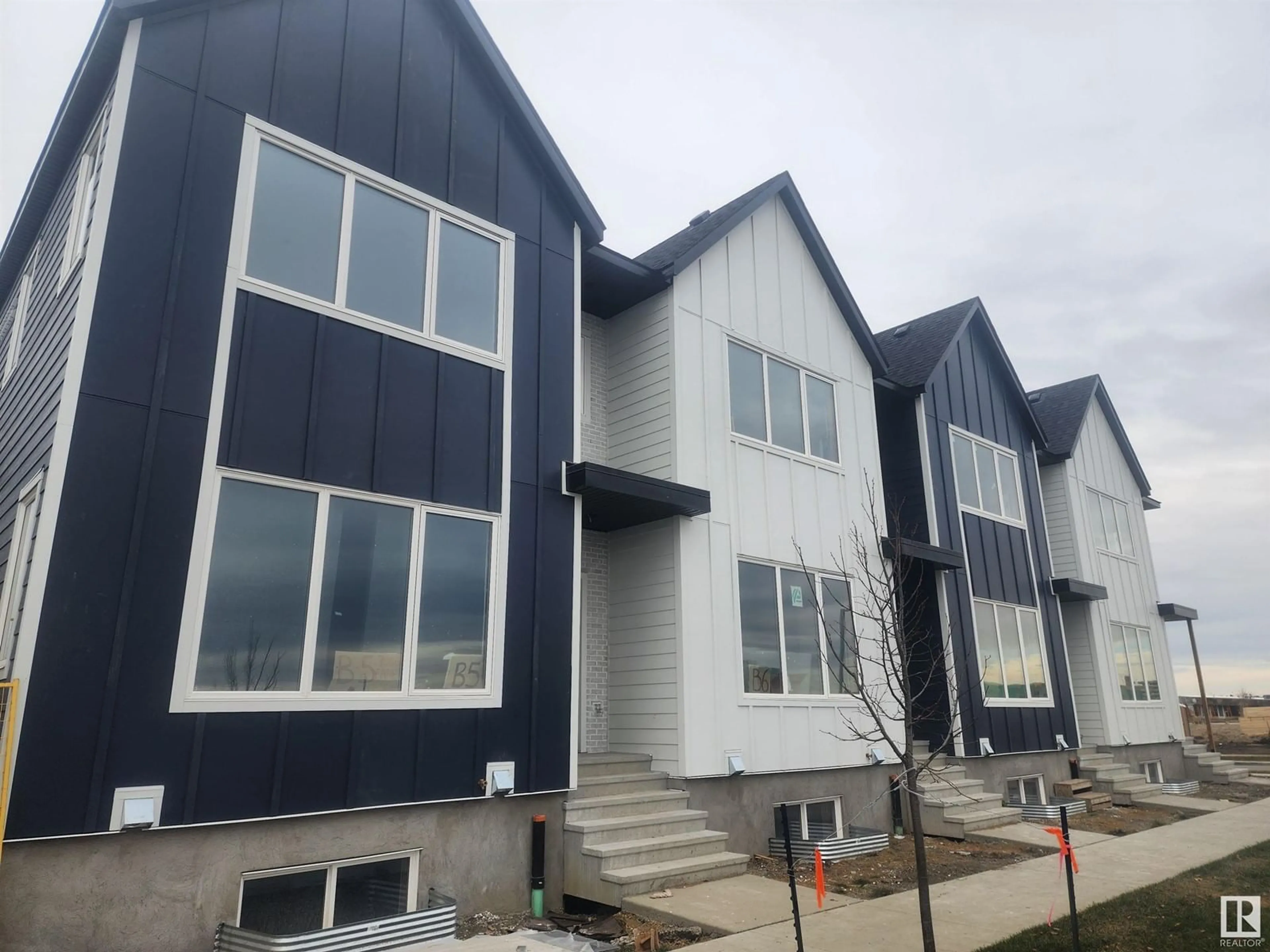 A pic from exterior of the house or condo, the front or back of building for #12 7066 FANE RD NW, Edmonton Alberta T5G2W6