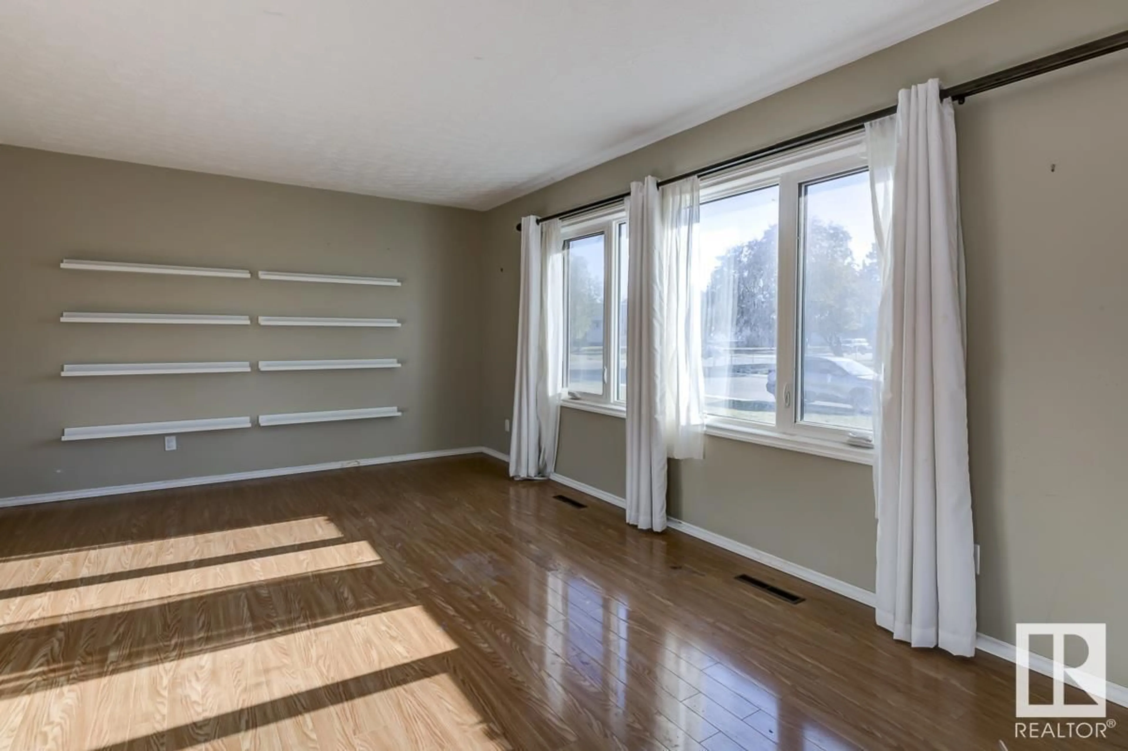 A pic of a room, wood floors for 4208 104 AV NW, Edmonton Alberta T6A0X2