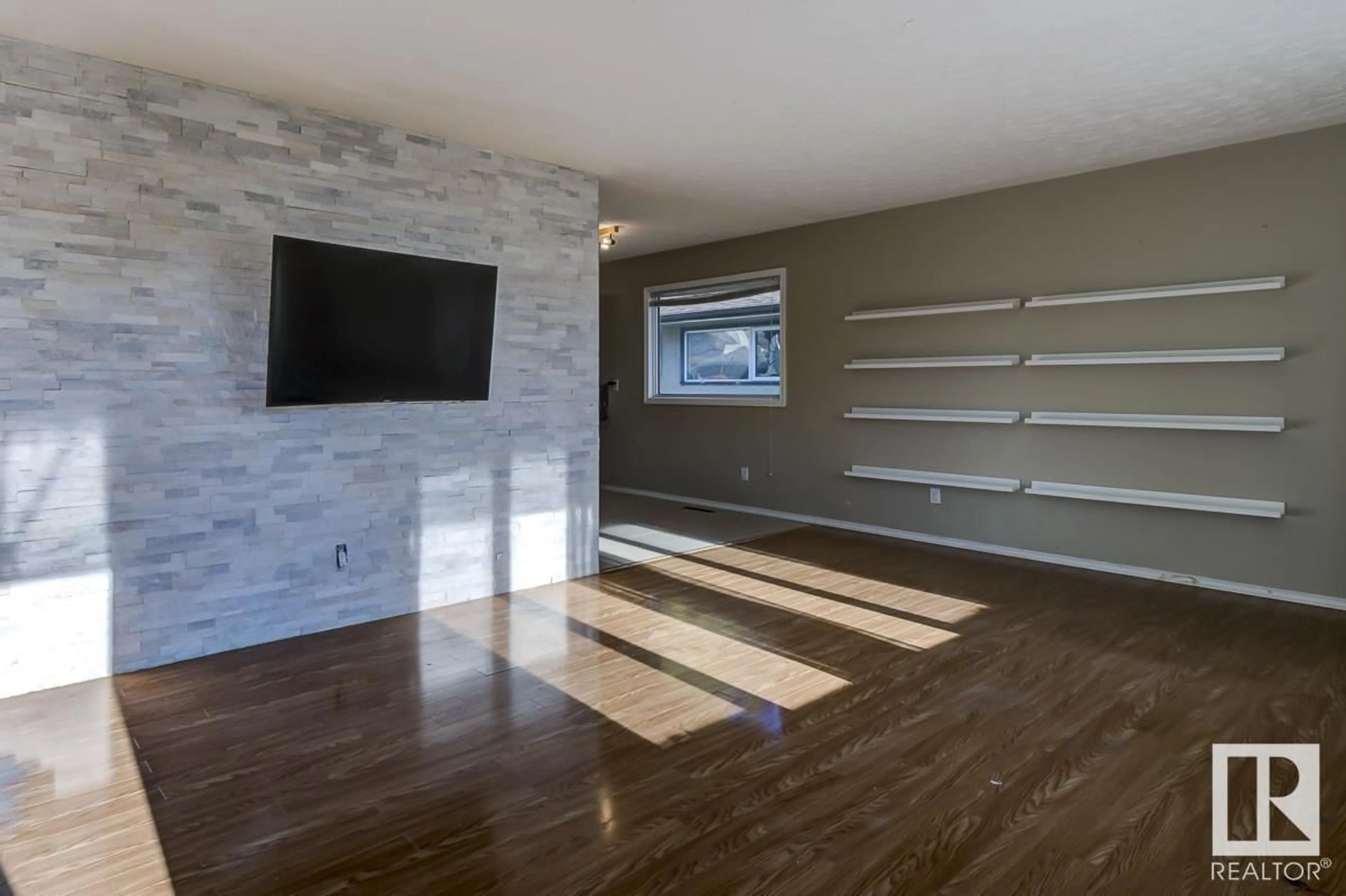 A pic of a room, wood floors for 4208 104 AV NW, Edmonton Alberta T6A0X2