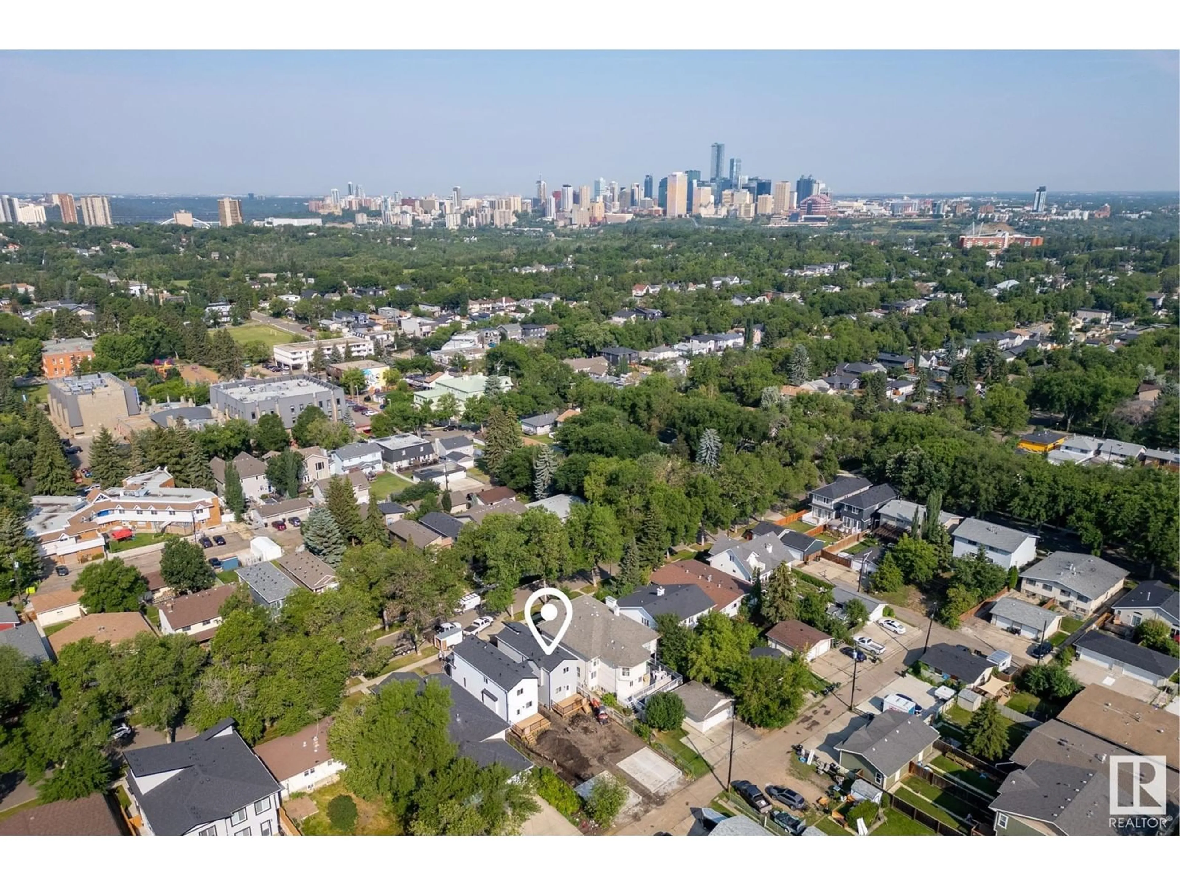 A pic from exterior of the house or condo, the view of city buildings for 8543 89 ST NW, Edmonton Alberta T6C3K4