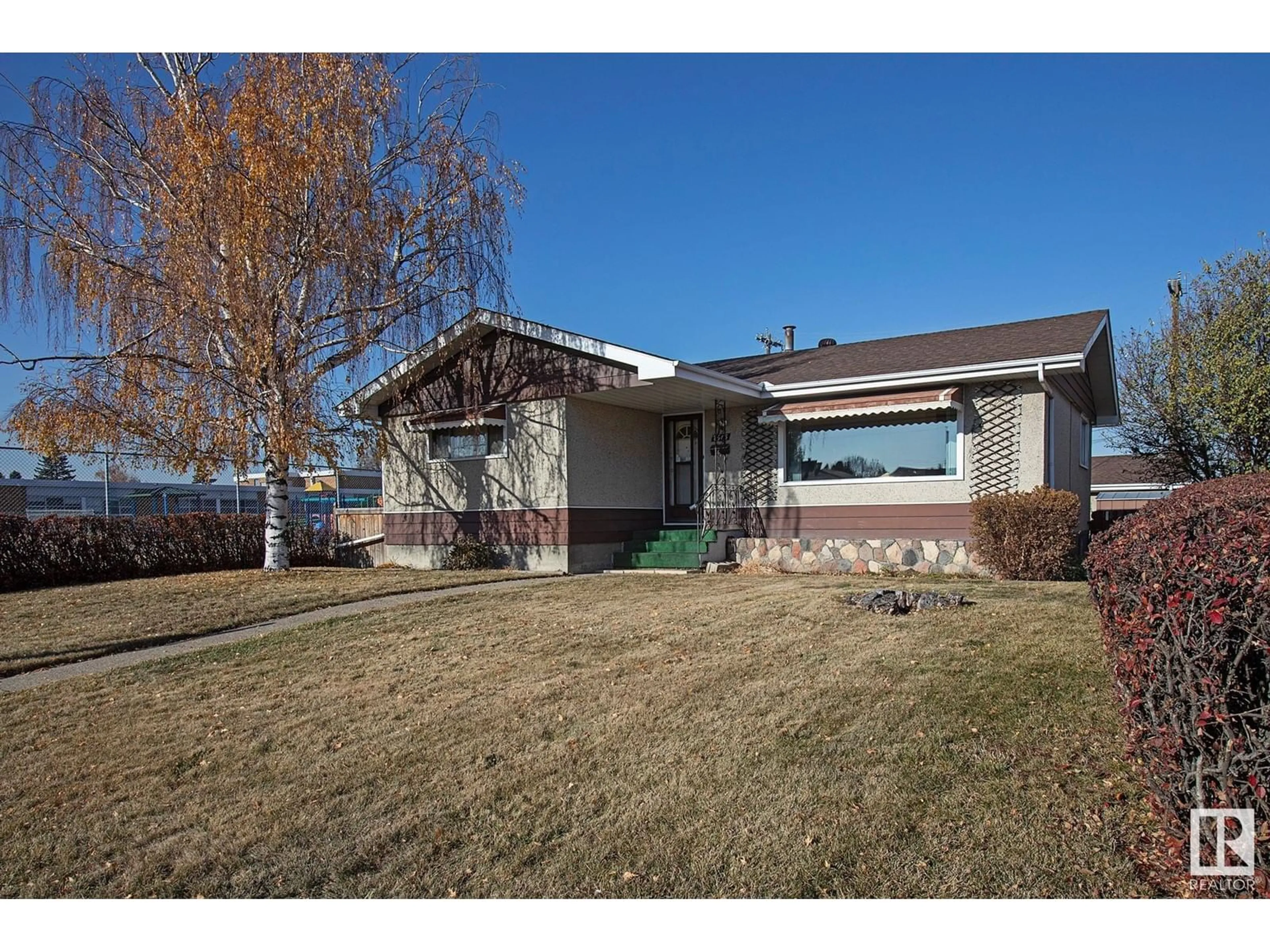 Frontside or backside of a home, cottage for 7616 130 AV NW, Edmonton Alberta T5C1Y2