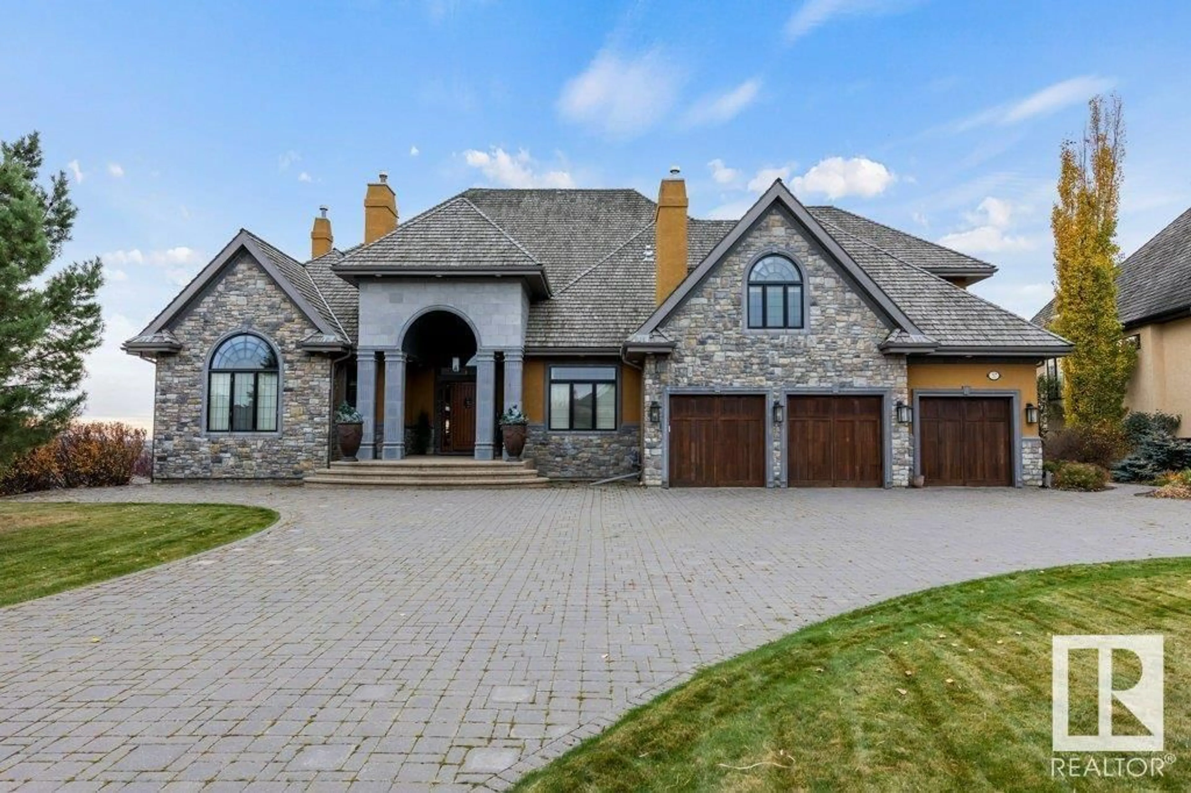 A pic from outside/outdoor area/front of a property/back of a property/a pic from drone, mountain view for 37 RIVERRIDGE ROAD, Rural Sturgeon County Alberta T8T0B9