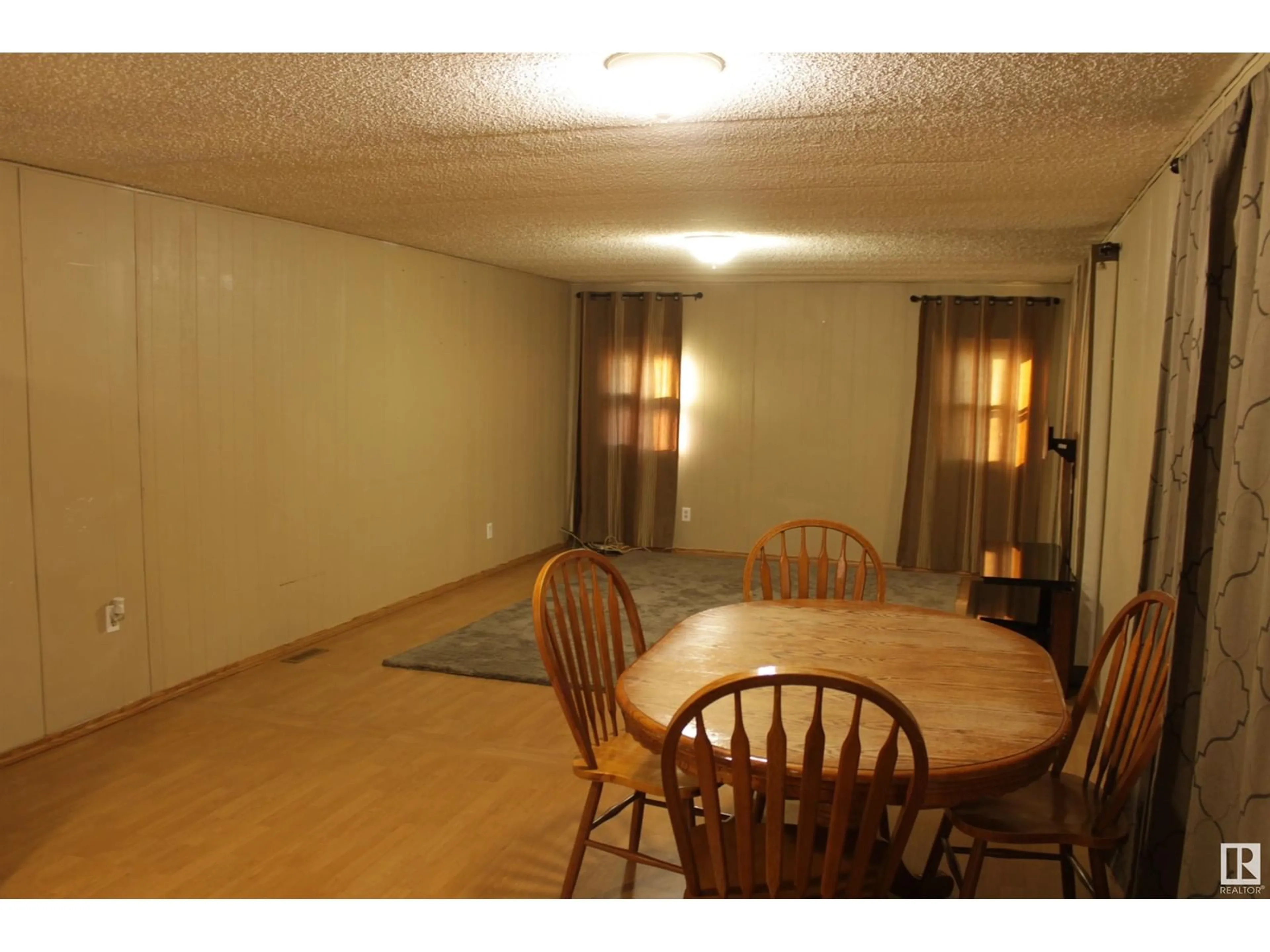 A pic of a room, not visible floor for #14 5403 52A St, Tofield Alberta T0B4J0