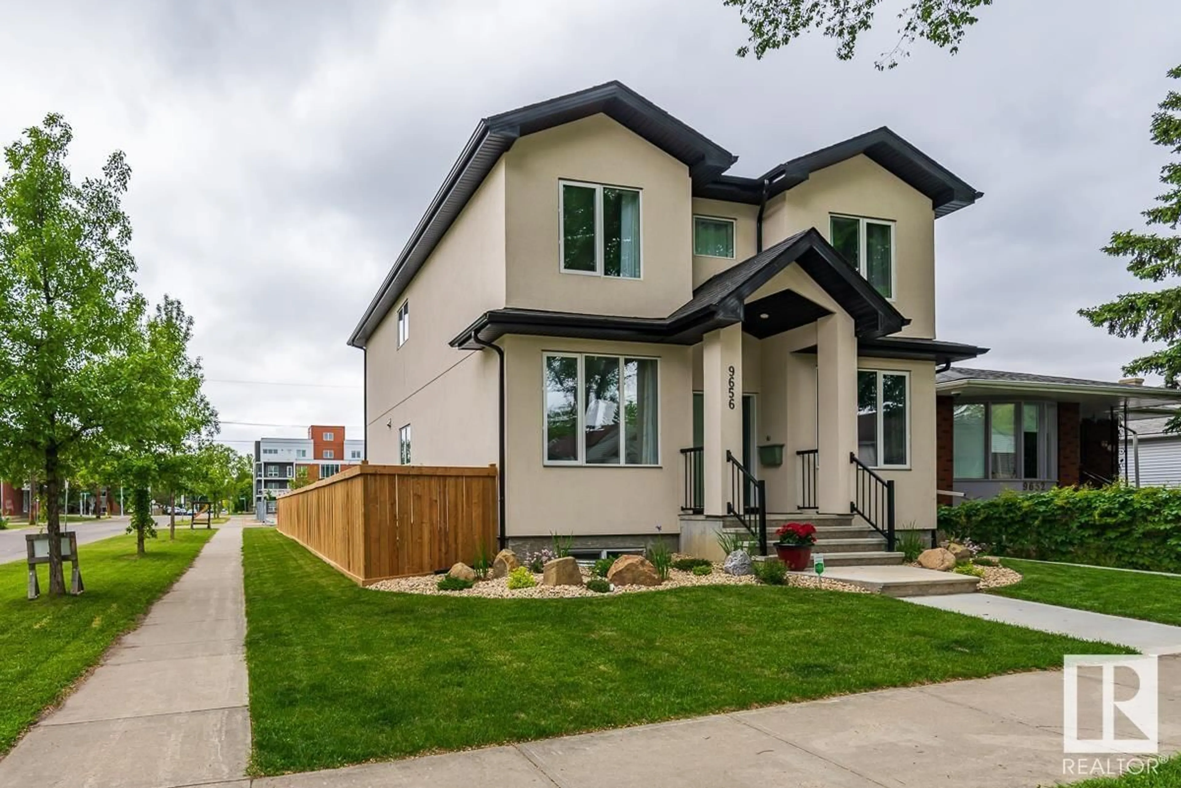 Frontside or backside of a home, the fenced backyard for 9656 81 AV NW, Edmonton Alberta T6C0X7