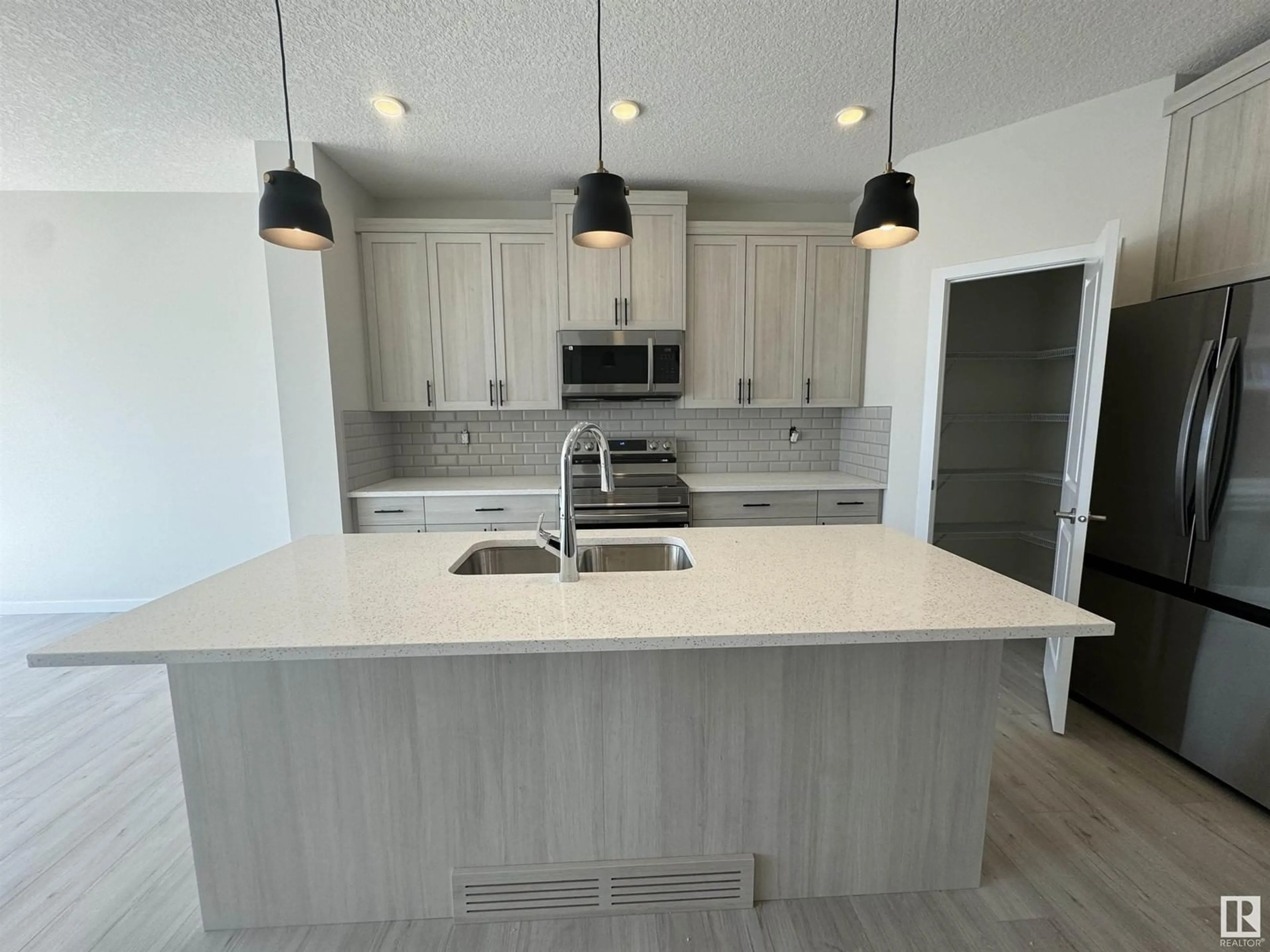 Open concept kitchen, unknown for 8909 ELVES LO, Edmonton Alberta T6M1J8