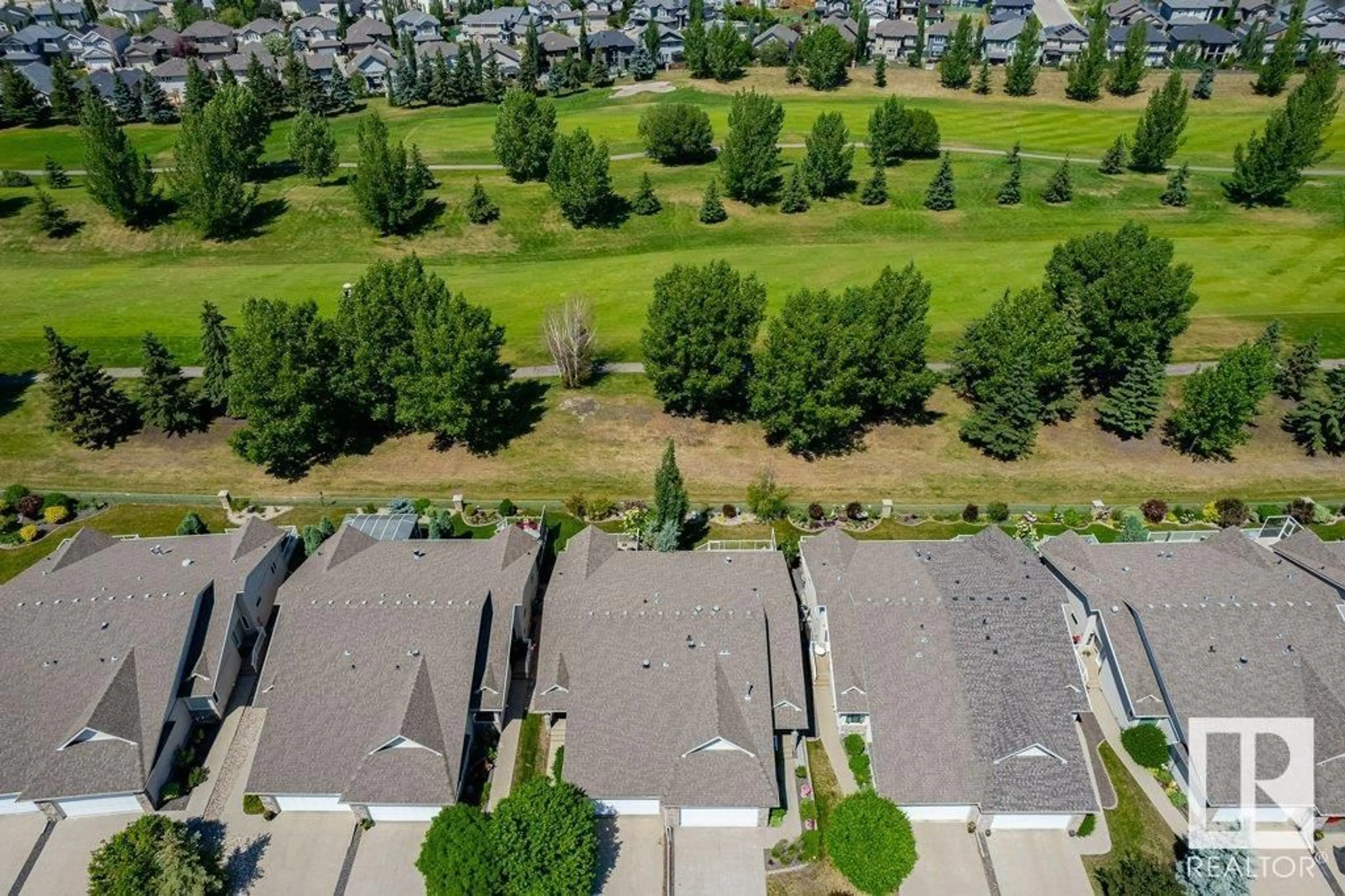 A pic from exterior of the house or condo, the fenced backyard for 20578 92A AV NW, Edmonton Alberta T5T3B2