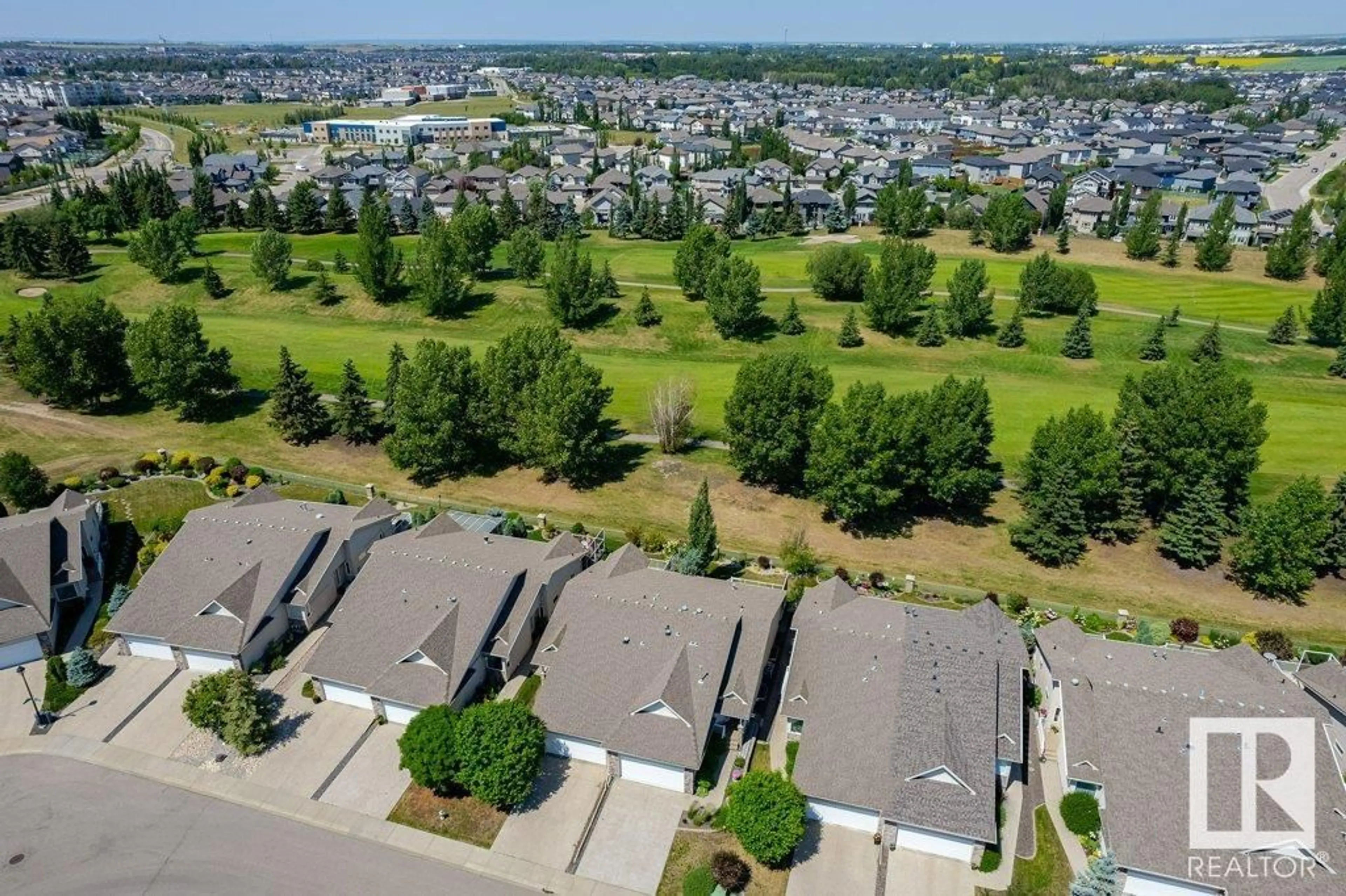 A pic from exterior of the house or condo, the fenced backyard for 20578 92A AV NW, Edmonton Alberta T5T3B2